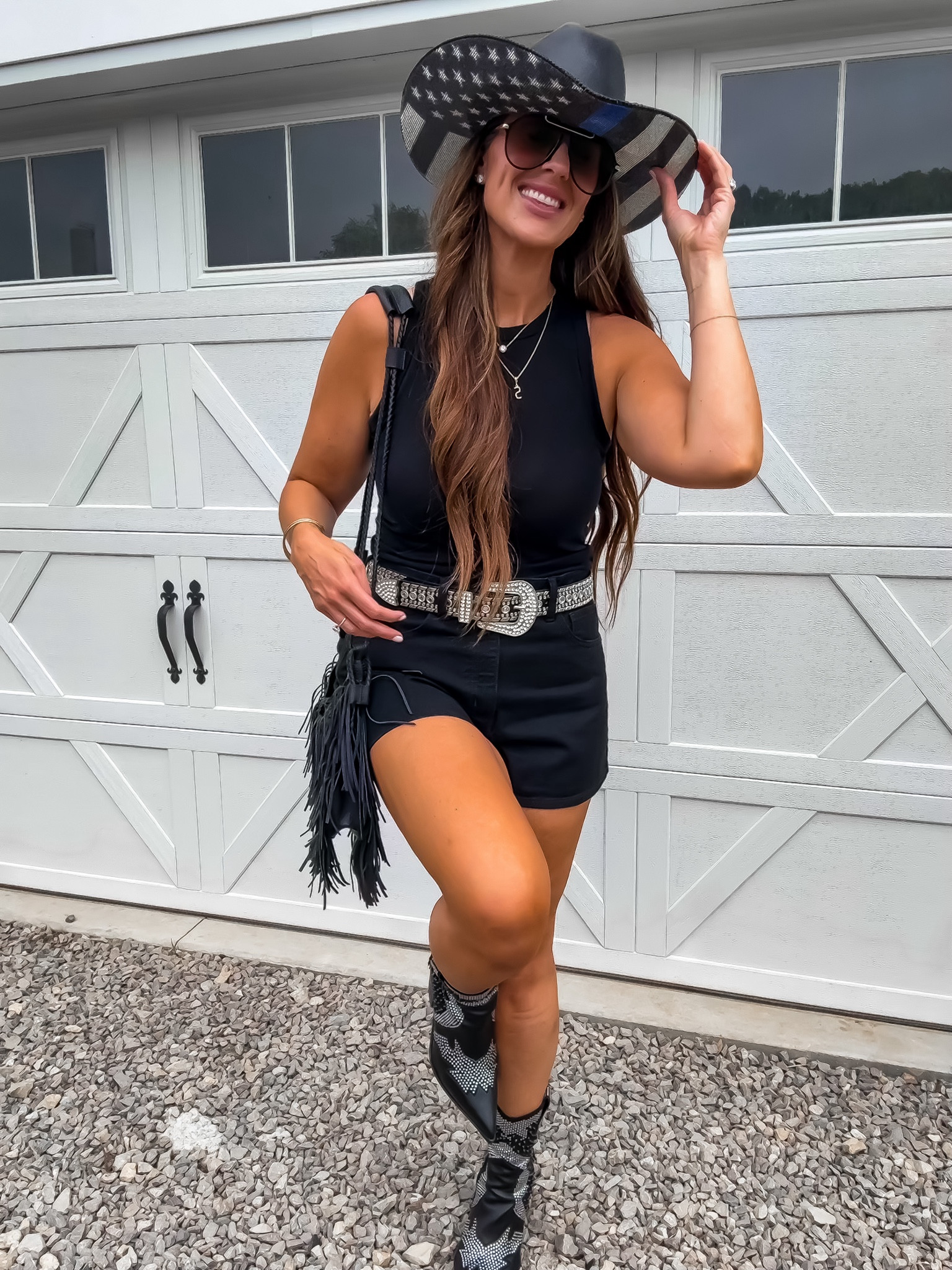 Country concert, outfit, inspiration, denim shorts, studded, rhinestone fringe boots, and fringe bag

#LTKfindsunder50 #LTKover40 #LTKmidsize