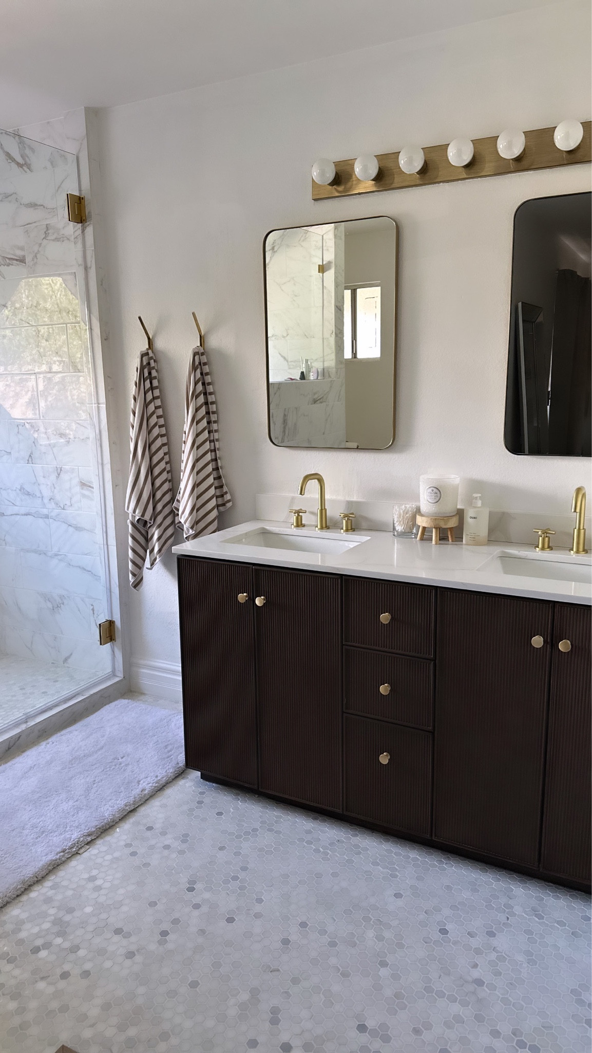 My master bath was a complete remodel. We call it Le Spa :) it feels so luxurious. every product is linked except my exact shower kit. The vanity has plug and USB outlets which makes it convenient for hot tools. 