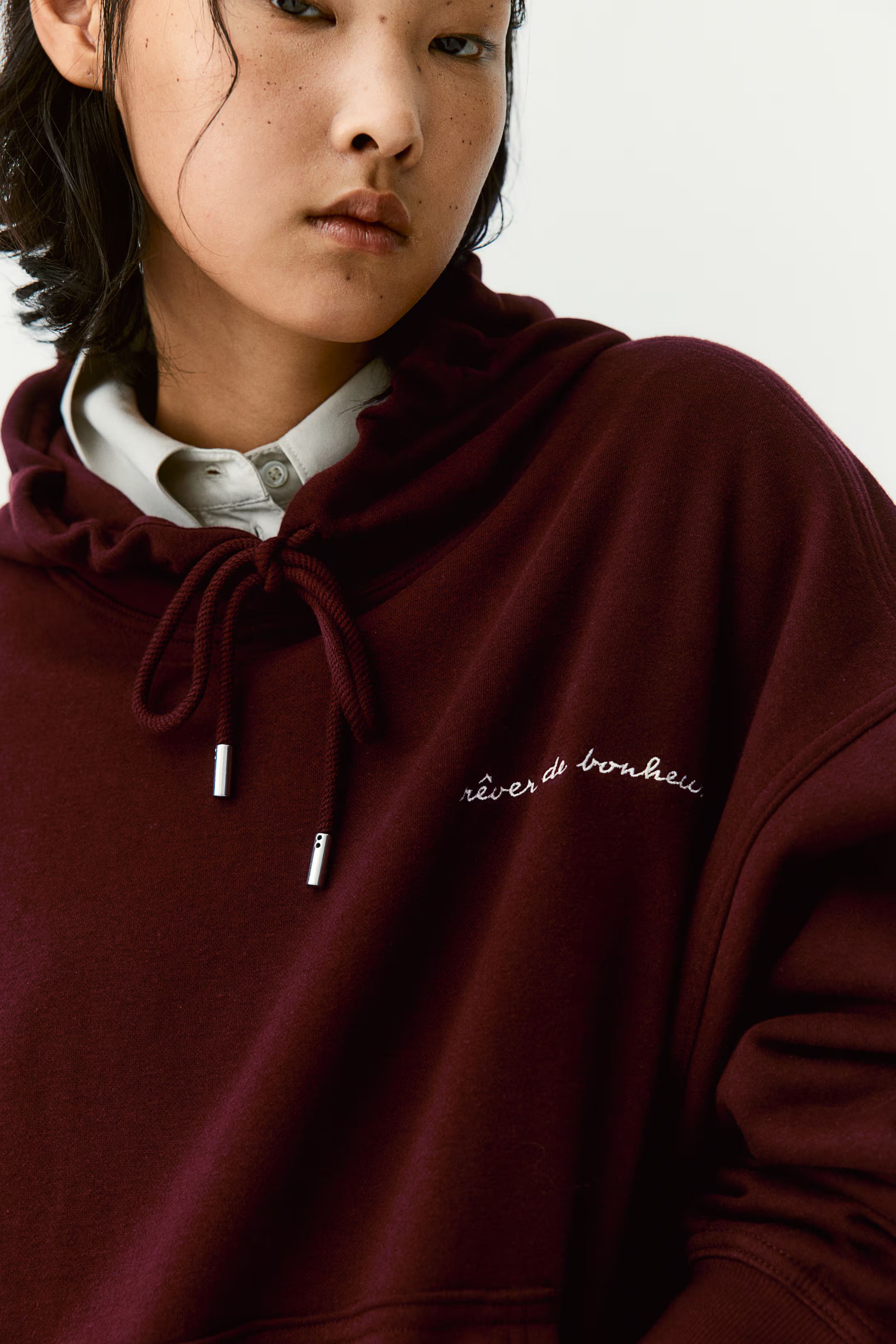 Loose-fit hoodie - Long sleeve - Regular length - Burgundy/Rêver de bonheur - Ladies | H&M GB | H&M (UK, MY, IN, SG, PH, TW, HK)