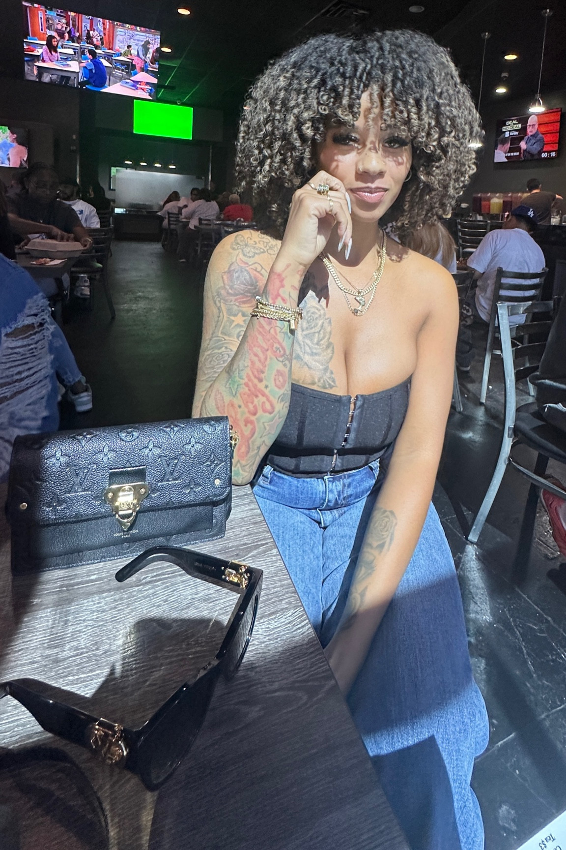 I am wearing a size 6 for reference. This top in black runs small. Def size up in the black one. All the other colors of this corset I have are a size 6 in :) hope this helps 