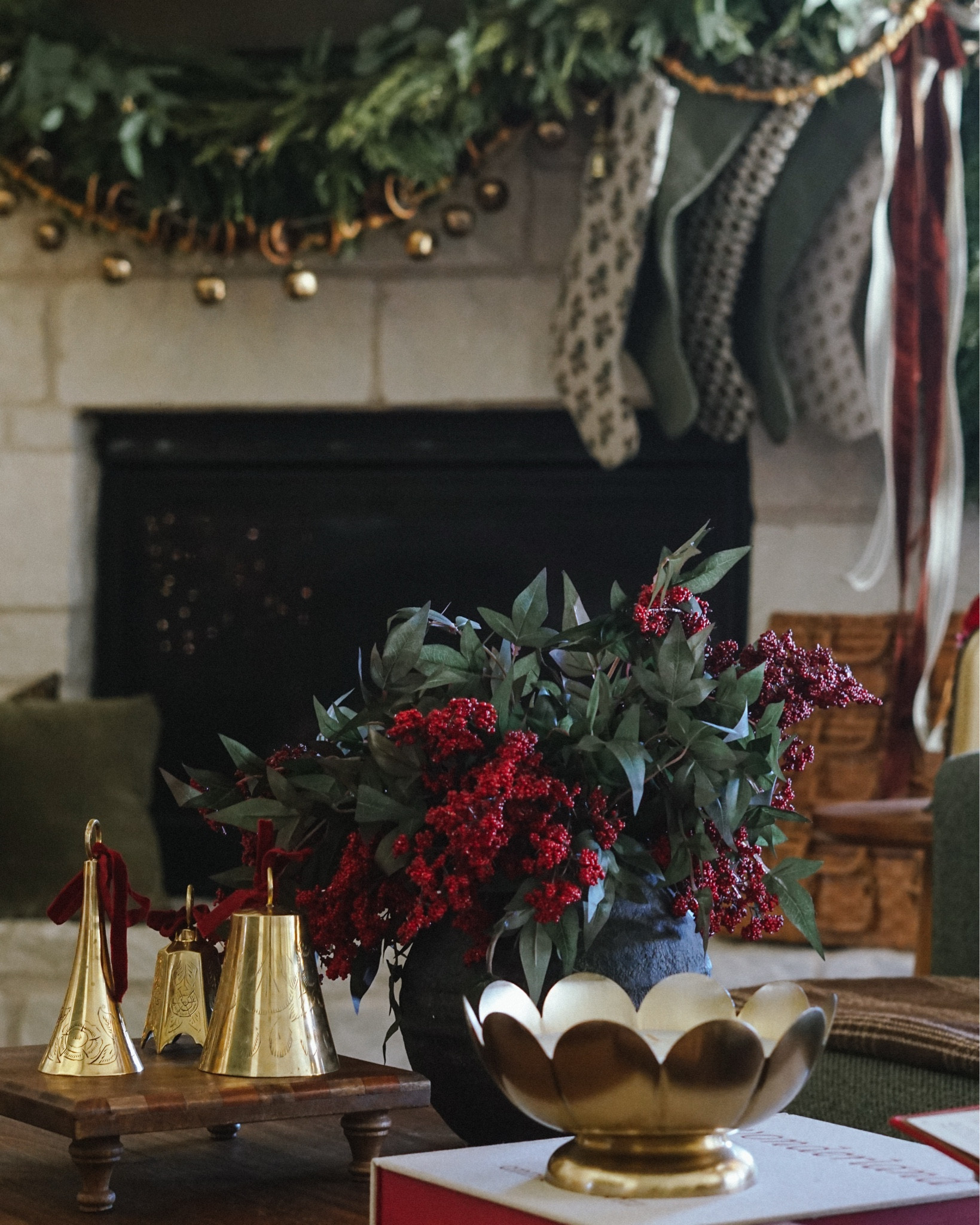 coffee table holiday decor, etched brass Christmas bells, red berry stems, coffee table holiday books, Christmas decor for styling

#LTKHoliday #LTKHome