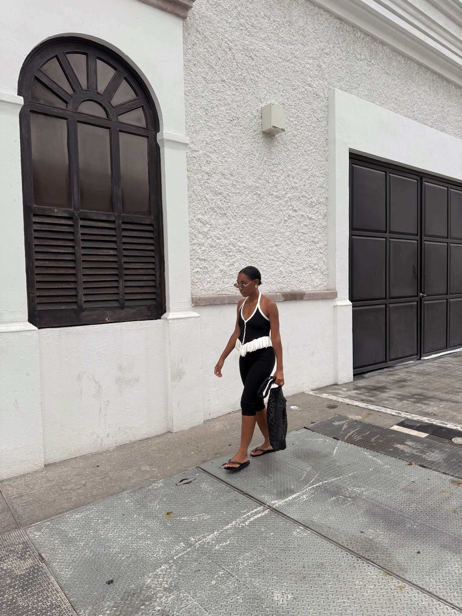 Black ribbed halter, black capri pants 

#LTKTravel #LTKStyleTip #LTKShoeCrush