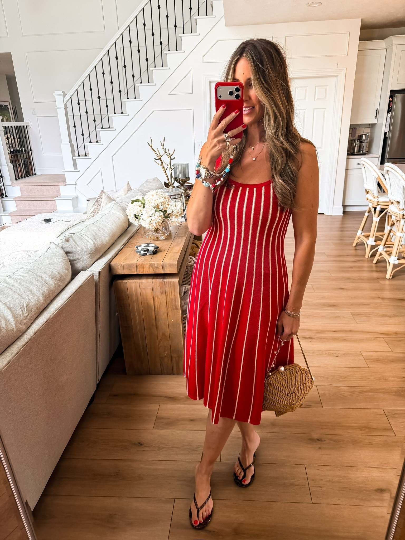 This dress is one of those pieces that looks effortlessly polished the second you put it on. The flattering fit, classic stripe detail, and bold red color make it perfect for summer dinners, holiday weekends, or dressing up with just a few simple accessories.

red dress, striped dress, summer dress, red midi dress, vacation outfit, Fourth of July outfit, resort style, summer date night outfit, chic summer dress, effortless style, woven handbag, themominstyle

#LTKootd #LTKTravel #LTKSeasonal