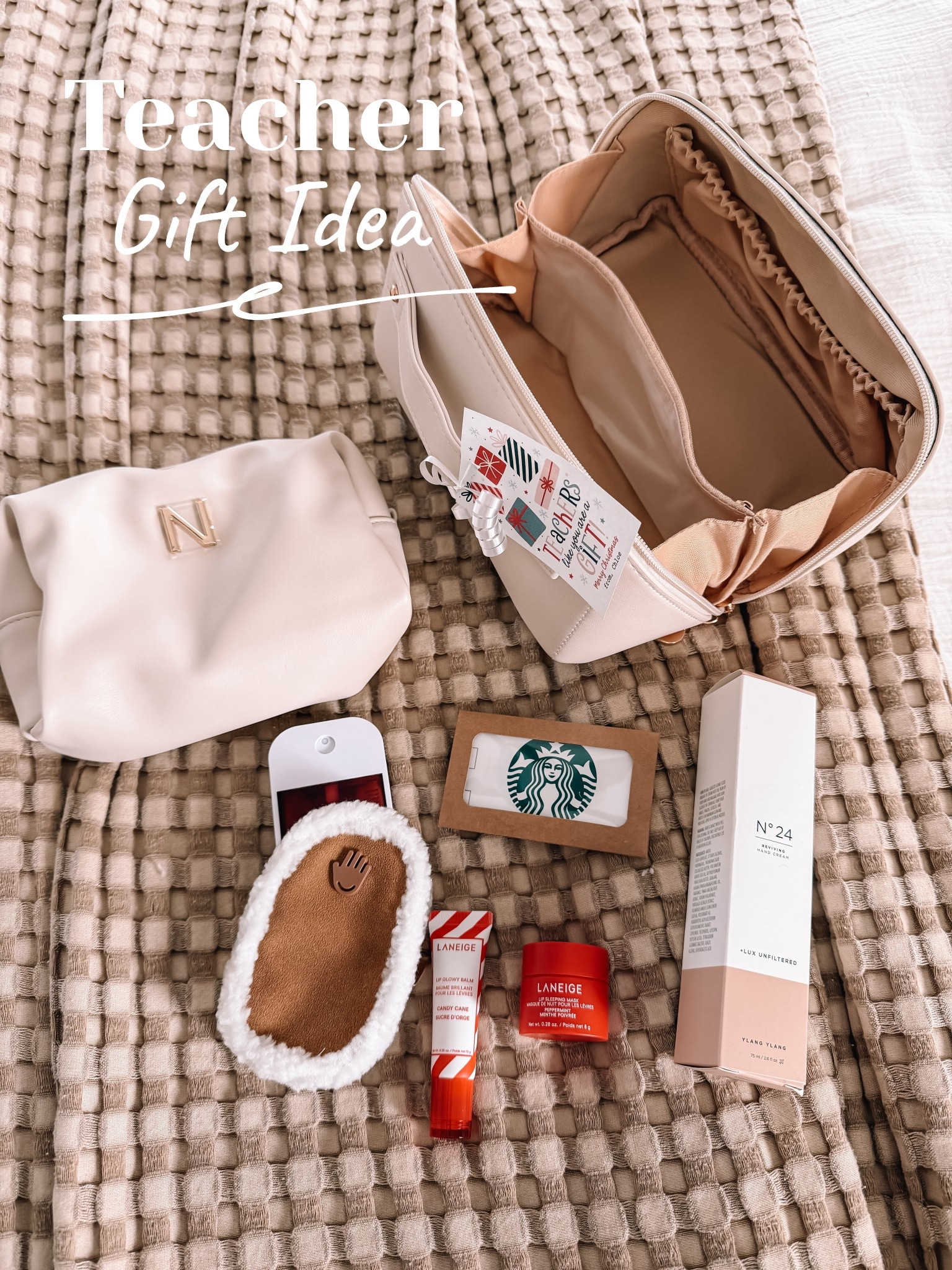 Teacher gift idea they’ll actually use 🙌🏼 I have this cosmetic bag and there’s truly nothing better — it fits SO much and keeps everything organized. I filled it with a few winter favorites: lip mask, candy cane gloss, Touchland, a cozy hand warmer + a Starbucks gift card 🎄🎁

Everything is linked here for you ❤️
@amazon #ad #founditonamazon #winterfavorites2025

#LTKOver40 #LTKHoliday #LTKGiftGuide