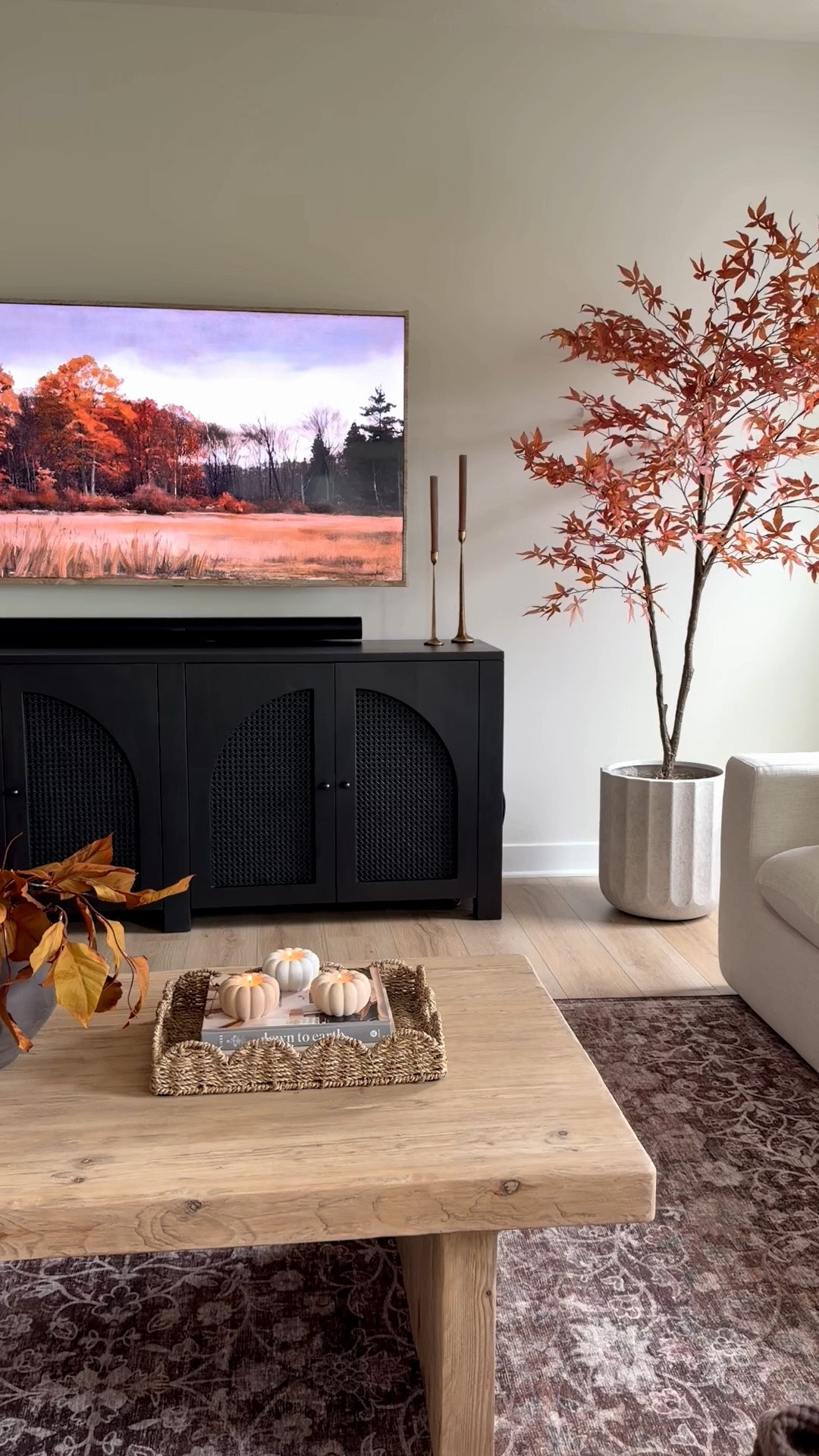 Fall console table fall sideboard table, fall decor, fall styling, wood coffee table, fall tree, maple tree, scallop tray, fall magnolia stems

#LTKSeasonal #LTKHome #LTKSaleAlert