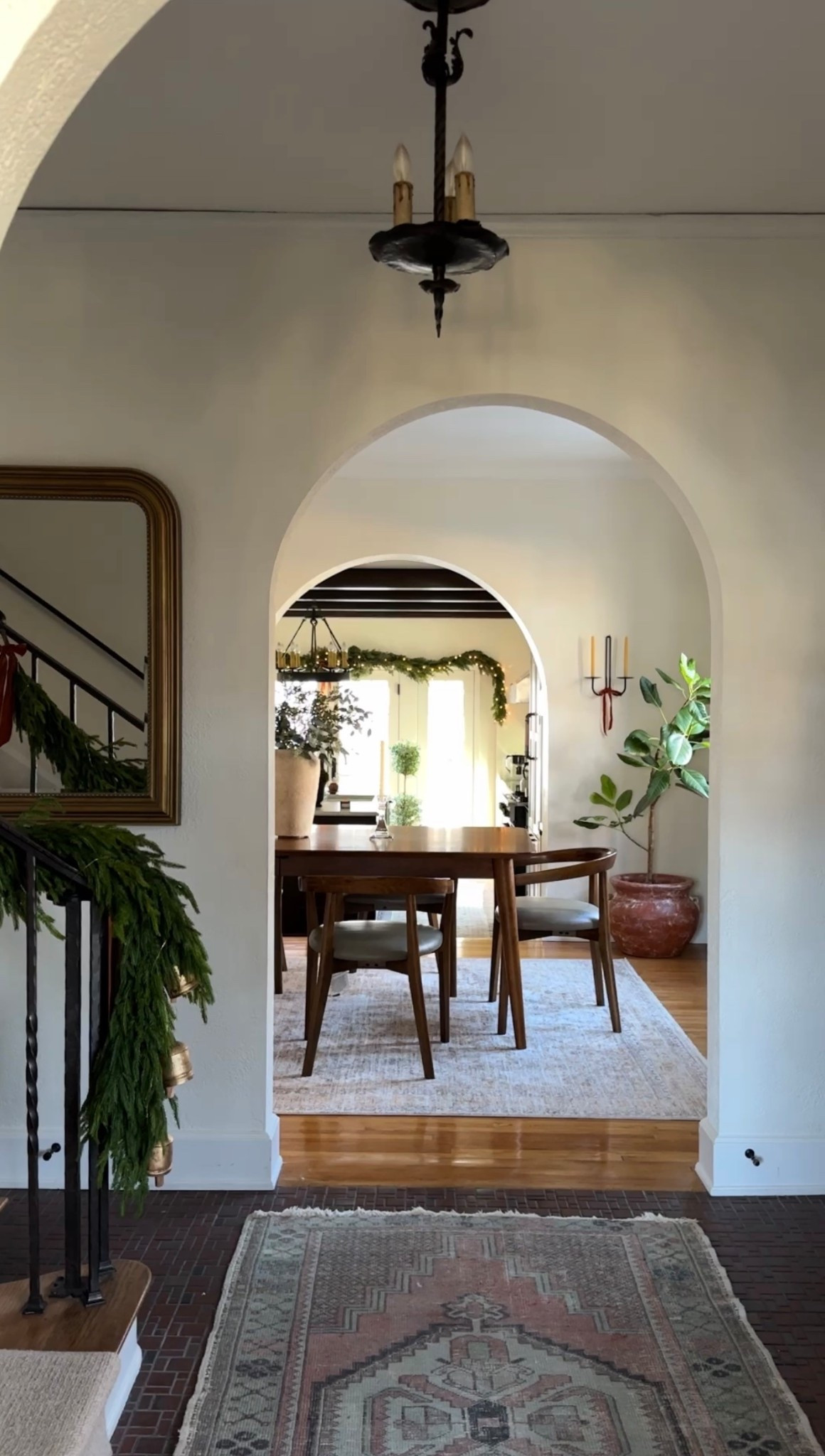 Christmas entryway: real touch garland, brass mirror, double sconces and velvet ribbons  

#LTKSaleAlert #LTKHome #LTKSeasonal