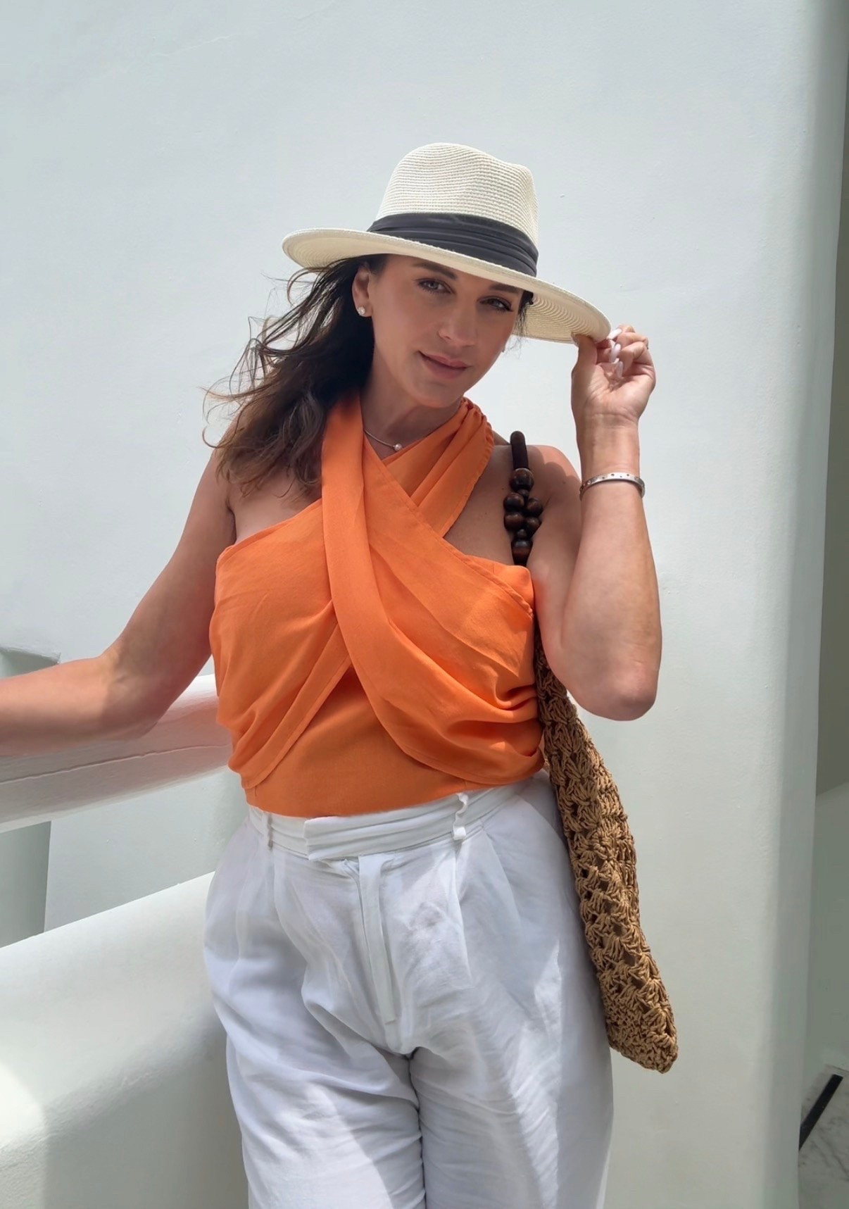 Linen style for your summer outfit! 

White line pants
Orange linen halter top