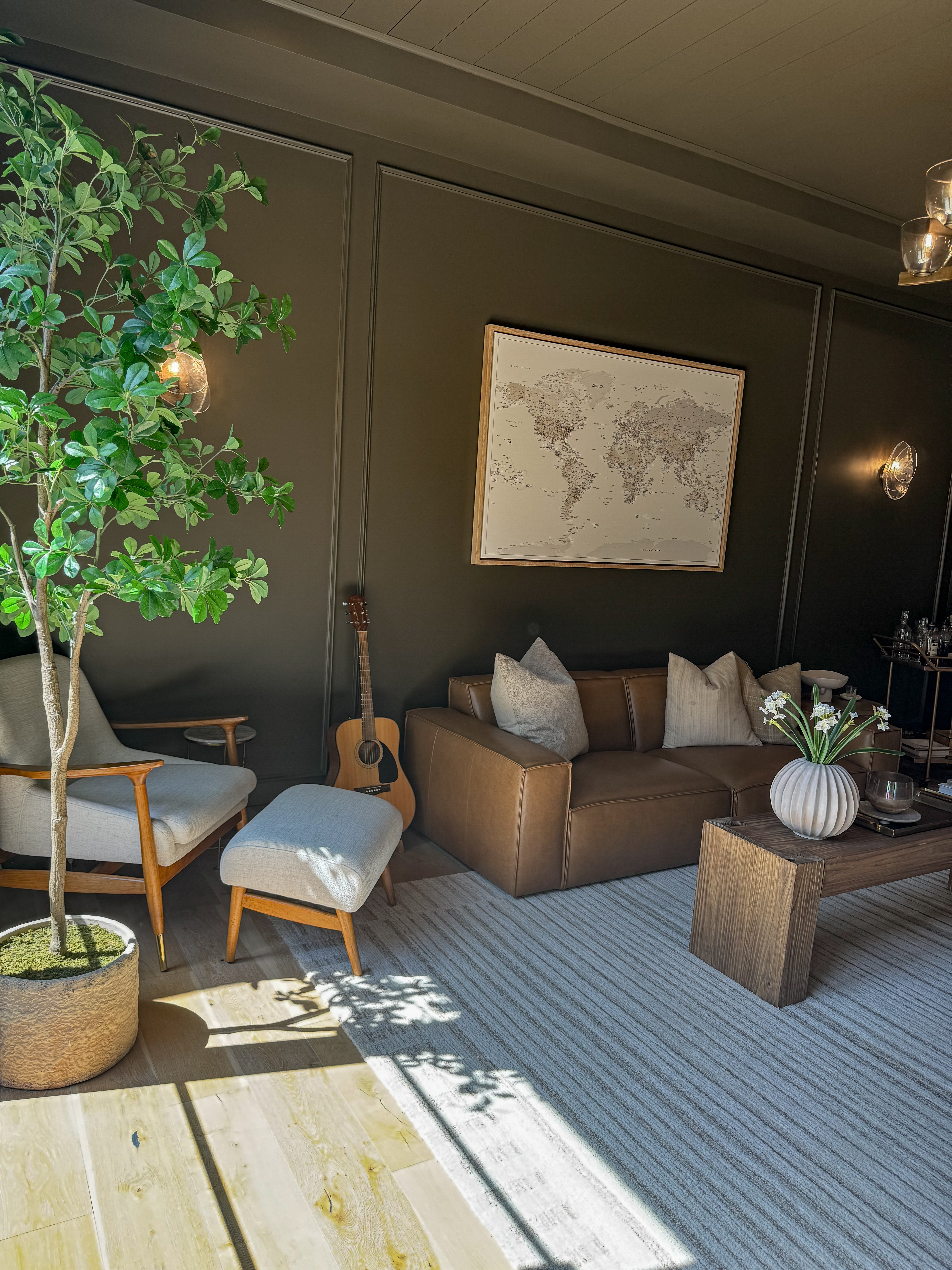 Shop our den! 

Moody den -large neutral area rug-leather sofa-rustic coffee table-accent chair with ottoman-artificial potted tree

#LTKSeasonal #LTKStyleTip #LTKHome