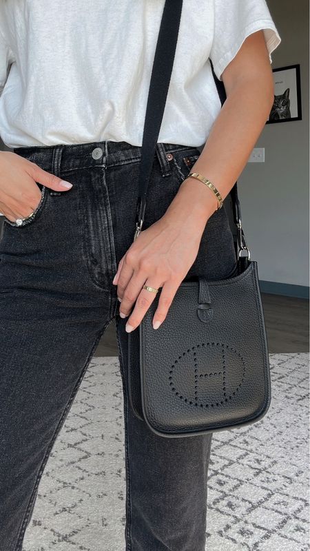 Simple and casual outfit of the day // oversized white t shirt, black ankle length jeans, white sneakers and black crossbody bag // summer style, spring outfit, style inspo, transitional dressing

#LTKSeasonal #LTKstyletip #LTKFind