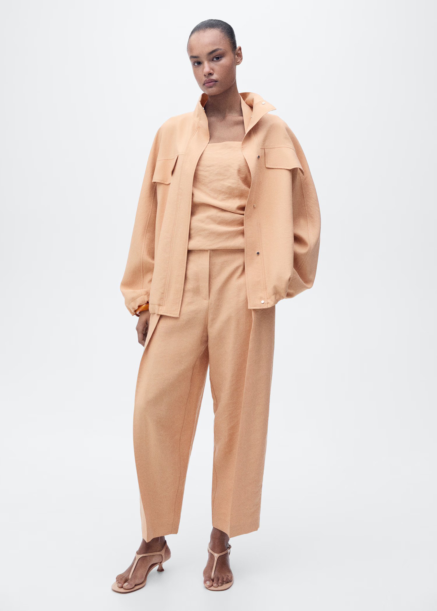 Straight-fit lyocell trousers with pleats - Women | MANGO United Kingdom | MANGO (UK)