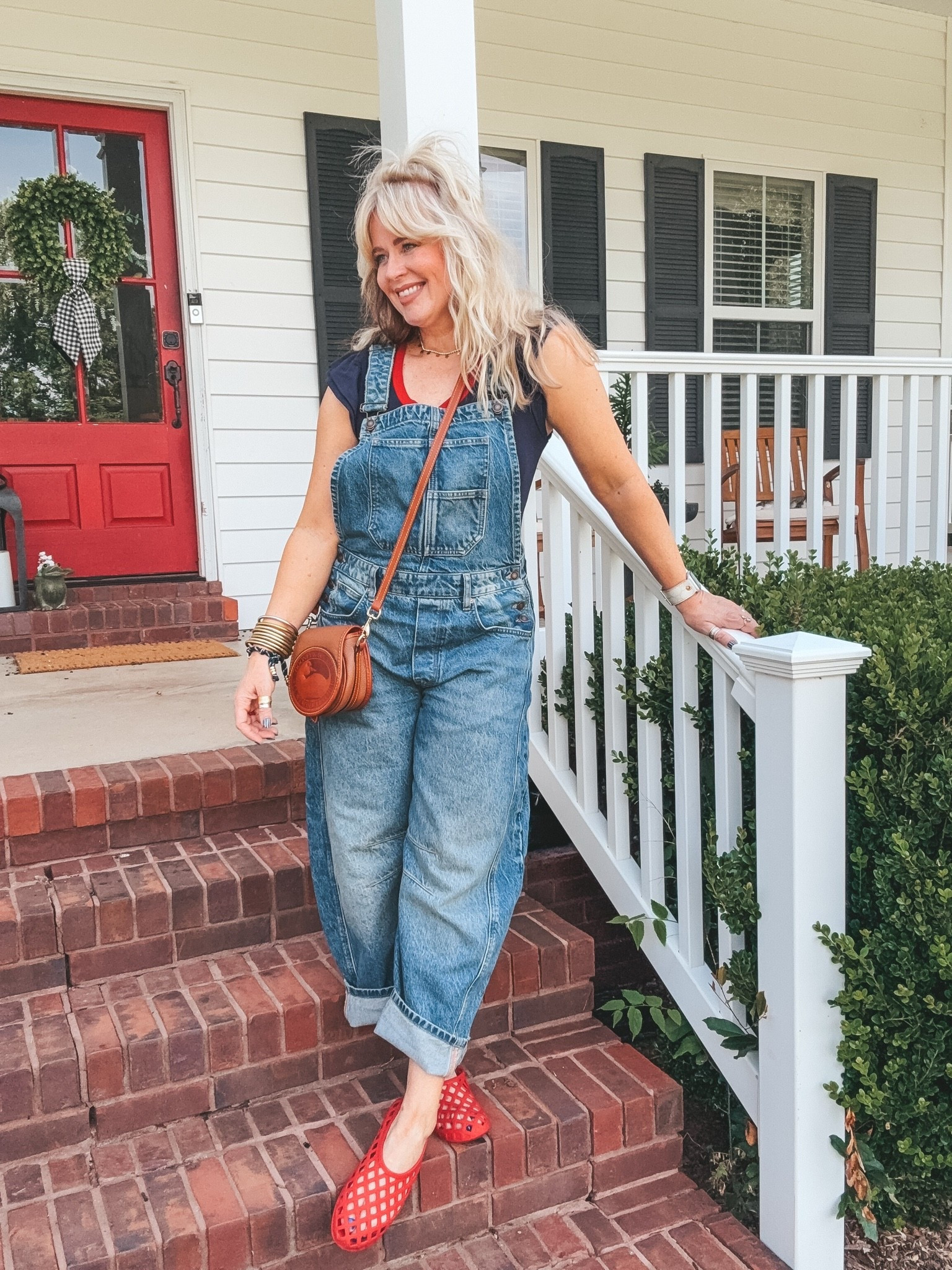 I love these overalls…seriously wear them all the time. I wear my true size. This ruffle sleeve top is so adorable and the colors are perfect for Memorial Day. 
I’m in a medium and my jelly shoes run true to size. 
#overalls #memorialdayoutfit #freepeople #dooneyandburke #jellyshoes

#LTKootd #LTKOver40