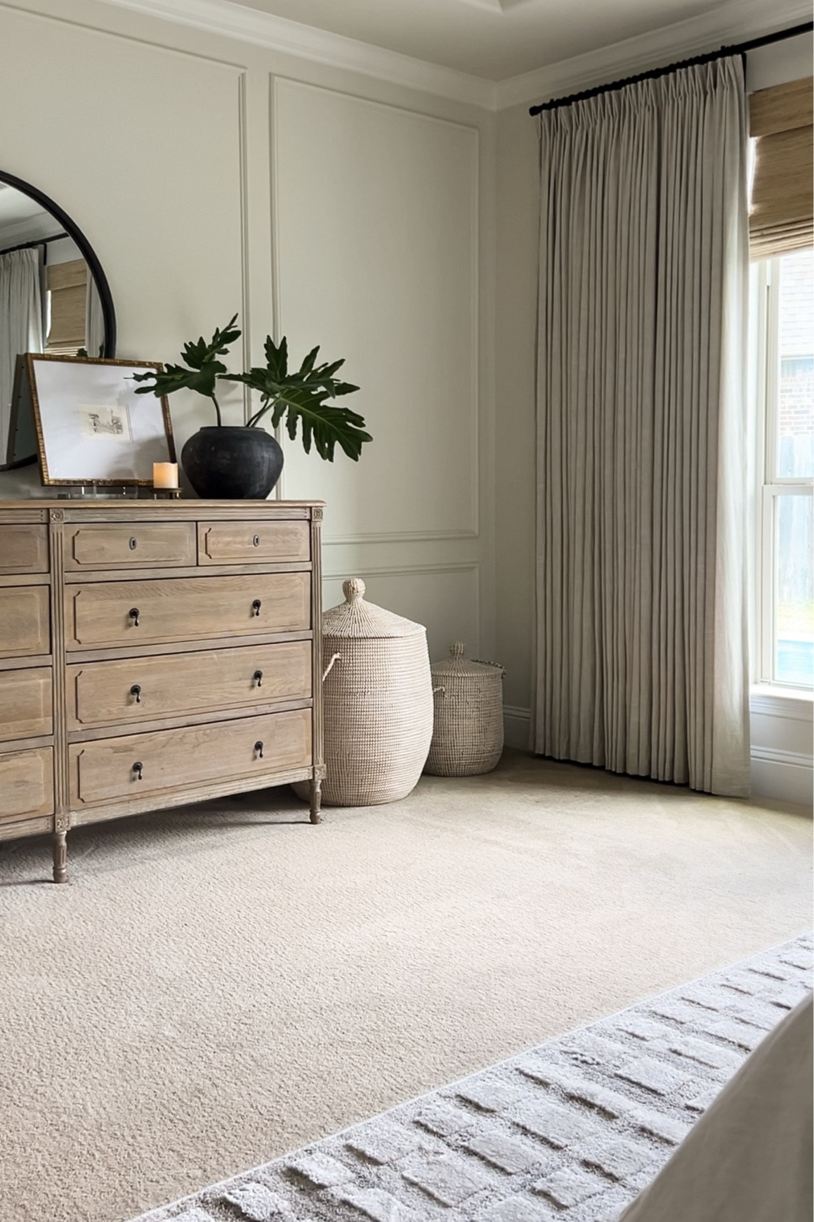 Neutral transitional bedroom dresser decor, linen drapes, bamboo shades, storage baskets with lids



#LTKHome