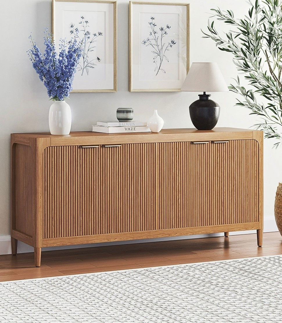 Introducing the My Texas House Linden Fluted Buffet Cabinet, a stylish yet functional addition to your dining area or accent space. Crafted from solid wood and finished in a warm brown tone, this cabinet brings both durability and warmth to your home. The standout fluted cabinet door fronts offer a unique texture that’s as beautiful as it is timeless. Inside, you’ll find two adjustable shelves that give you the flexibility to organize your space just the way you like it. The soft-closing, euro-style hinges ensure a smooth, quiet close every time, while the antique gold metal finger pulls add a touch of elegance. Whether you’re storing dishware, linens, or everyday essentials, this buffet cabinet blends style and practicality seamlessly into your home. Perfect for those who love to entertain or simply want an eye-catching storage solution, this piece brings contemporary charm into any room.

#LTKHome