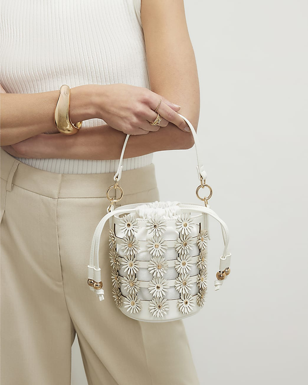 Cream 3D Floral Cut Out Bucket Bag | River Island UK & IE
