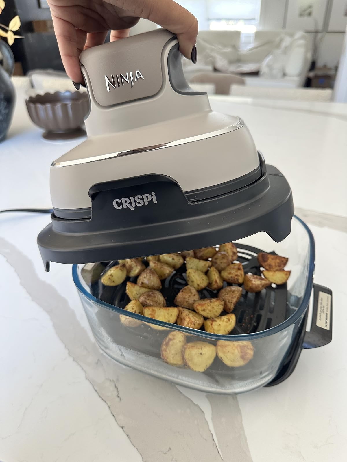 Perfect for quick and healthy meals! Ninja Crispi Air Fryer rocks! Crispy, even cooking. Easy clean-up. Versatile kitchen appliance. | Amazon (US)