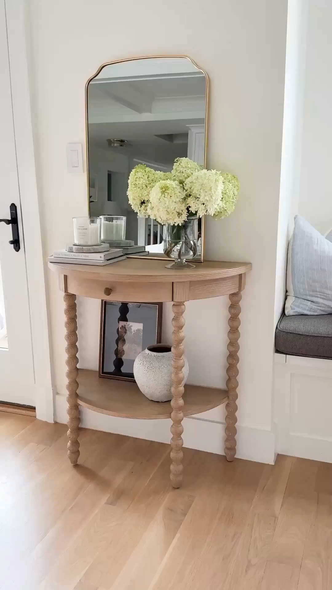 The most beautiful carved wood demilune table from Serena and Lily! I balanced the splurge purchase by styling it with plenty of affordable decor, pieces from target and Amazon! I love the cozy Nancy Myers vibe that this gives to our small blank wall by the kitchen. Would be perfect in a small entryway too as a drop zone for keys and sunglasses.

#LTKSeasonal #LTKHome