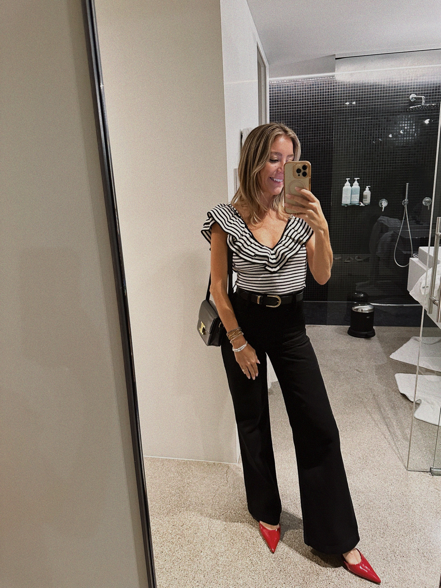 Can never go wrong with black denim and a bodysuit with a pop of red! ❤️living in these high waisted jeans and red shoes. Invest in key pieces that will live in your wardrobe for life like this bag. 

#LTKStyleTip #LTKShoeCrush #LTKSeasonal