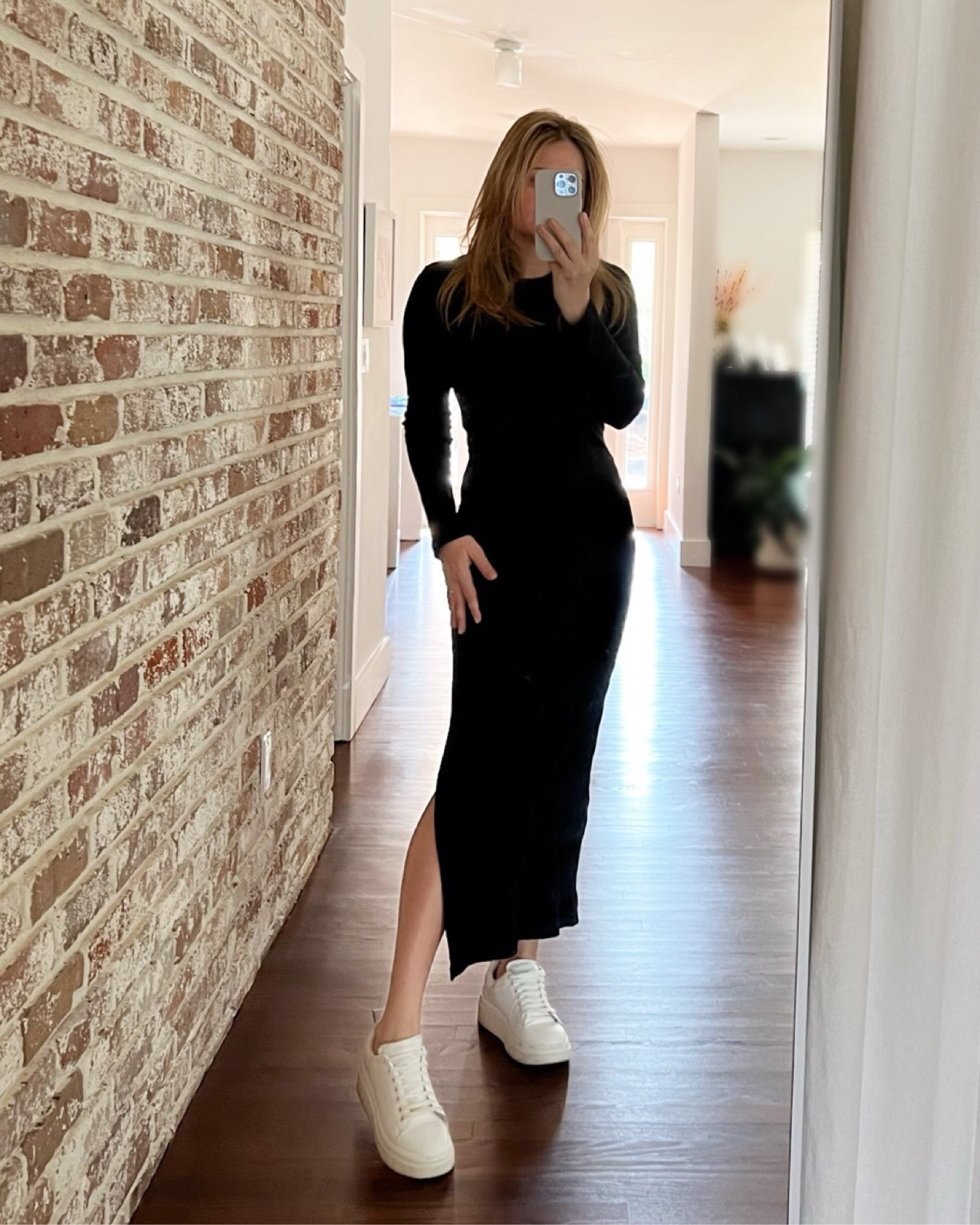 Long sleeve black midi dress with a side slit and sneakers. Material is fitted but stretchy and I actually wore this as a travel outfit with sneakers and a denim jacket. 

#LTKstyletip #LTKsalealert #LTKtravel