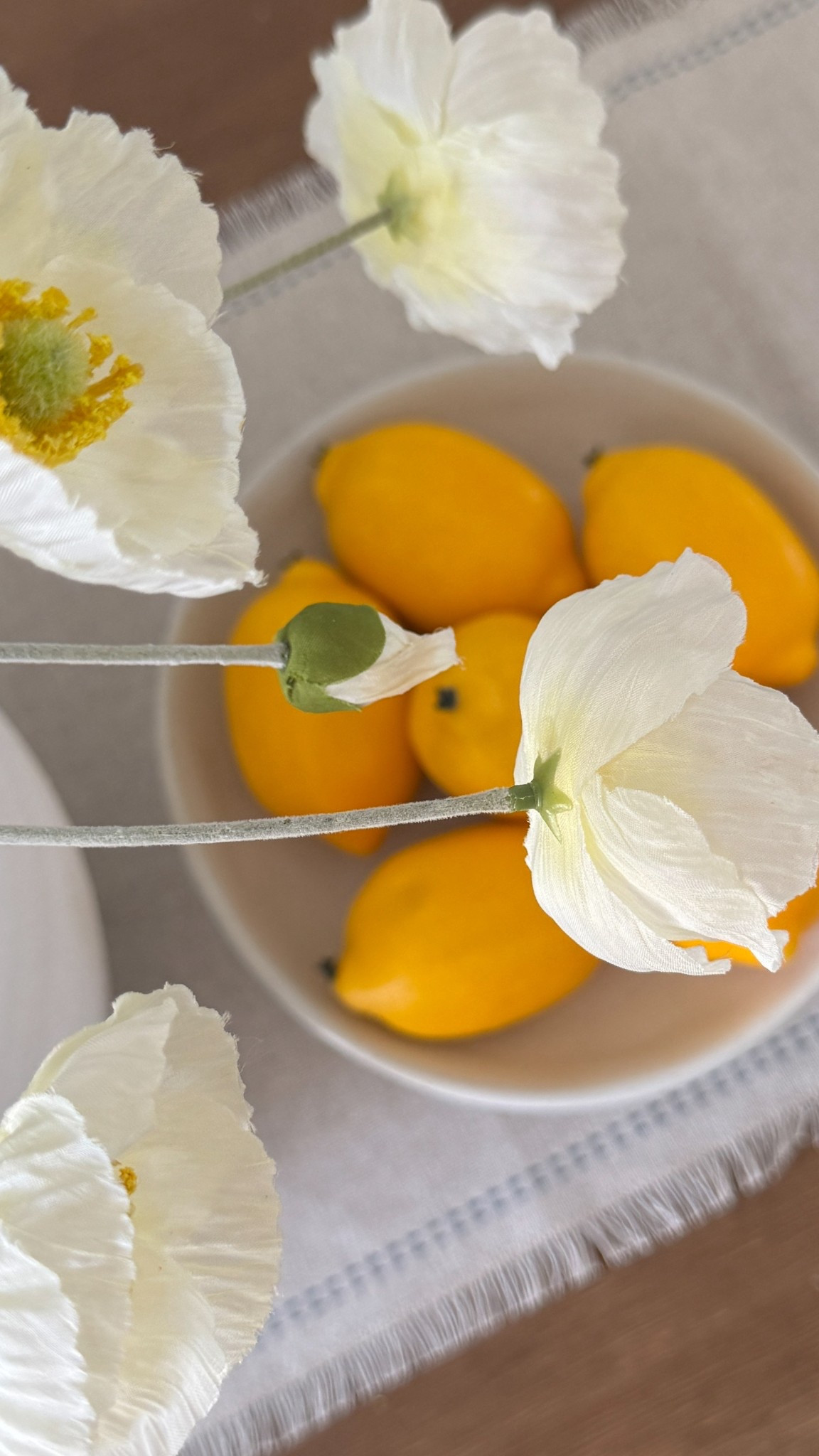 These faux poppies instantly brighten up any space & and this ceramic bowl filled with lemons? Such a simple, pretty moment on the dining table. Both are affordable home finds I always reach for when styling! 🍋


#DiningTableDecor #FauxFlowers #PedestalBowl #NeutralHomeStyle #ModernOrganicHome #LTKHomeFinds

#LTKHome #LTKFindsUnder50 #LTKStyleTip