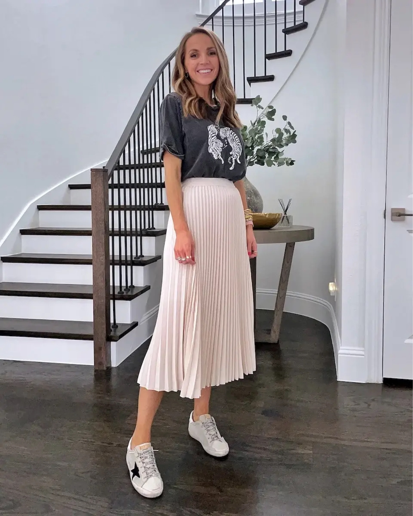 Pleated skirt dressed town with graphic tee and sneakers 

#LTKSeasonal #LTKshoecrush #LTKstyletip