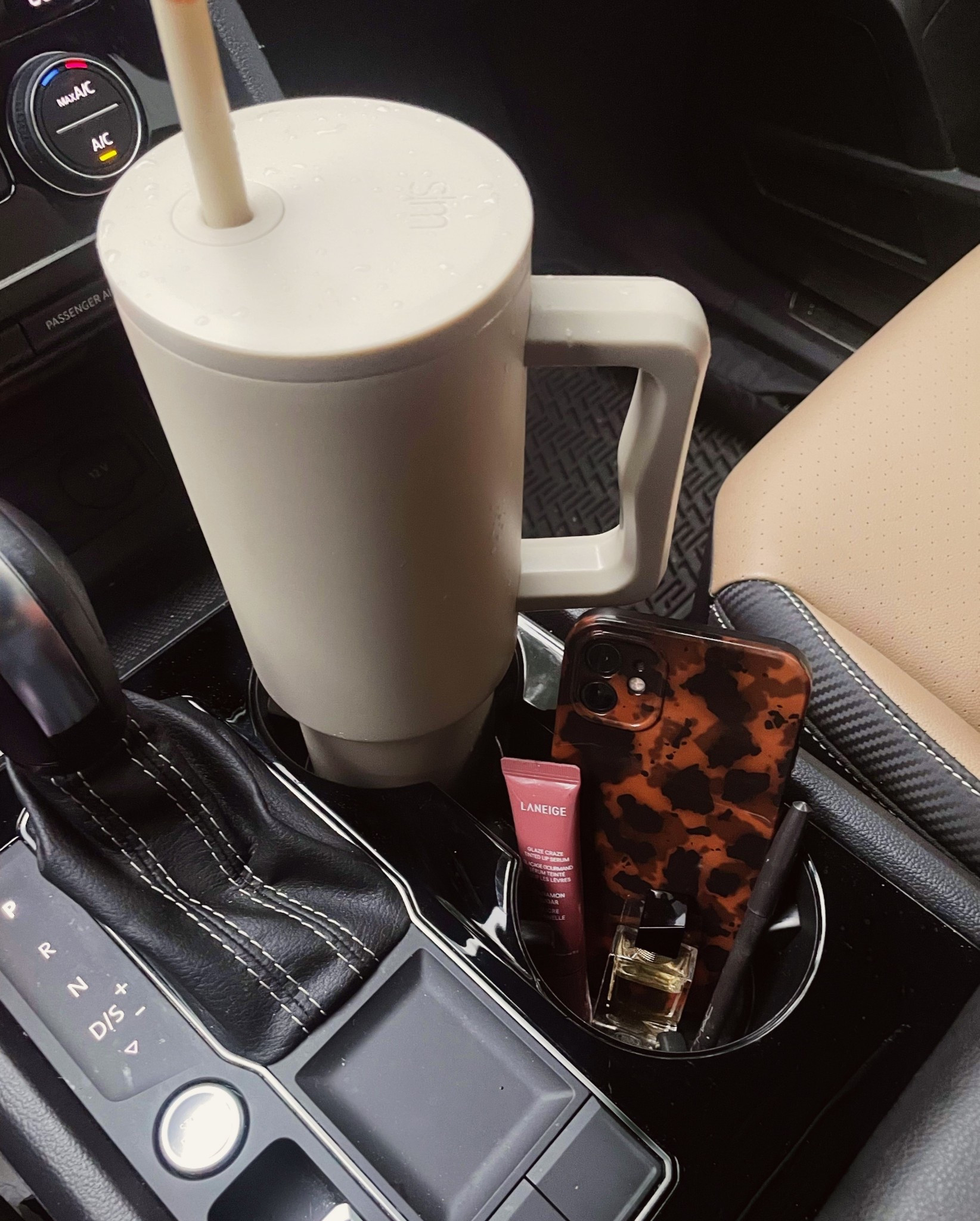 Always have a few staples in my car, my Simple Modern tumbler, Laneige lip glowy balm, tortoise phone case, and a mini perfume for touch ups. They make everyday drives feel a little more polished ✨

#LTKFindsUnder50 #LTKHome #LTKStyleTip