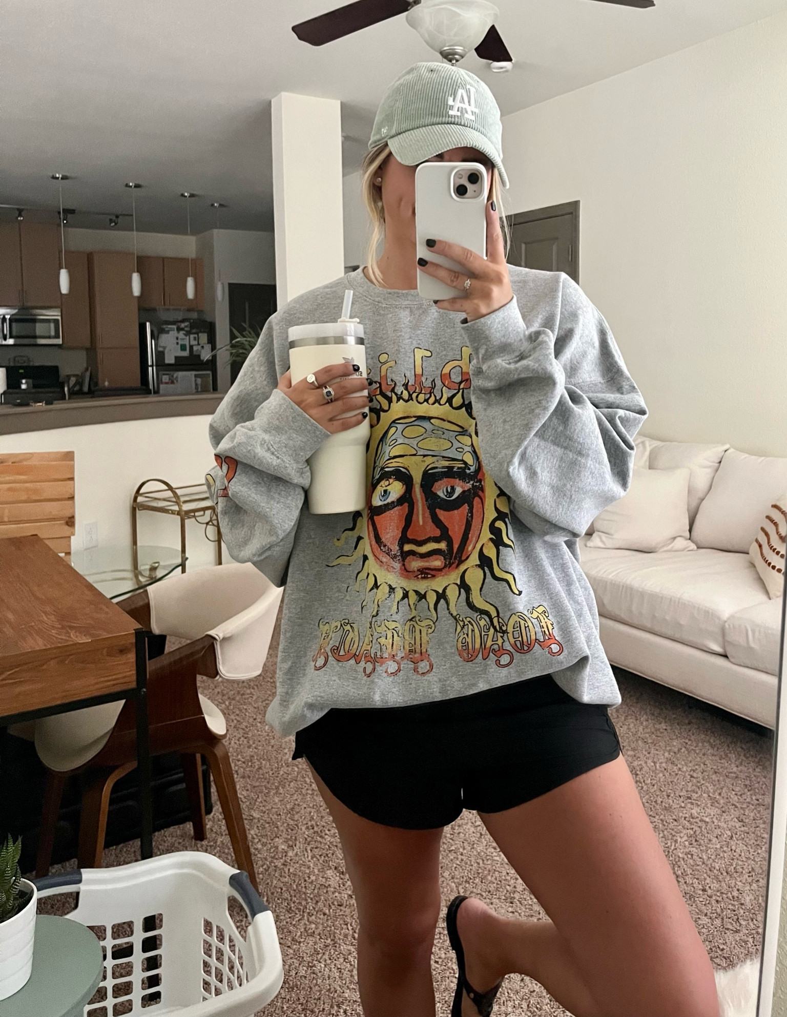oversized sweatshirt, shorts, ball cap, stanley cup, sandals 