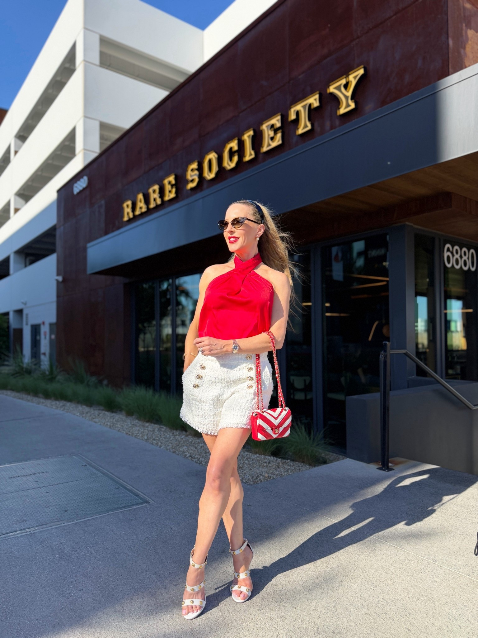 OOTD for cocktails with the girls 🥂 red satin halter neck top, @thenolishop white tweed gold button shorts, red & white chevron Chanel bag. The bag is from JoinSwitch, use code DawesEve22J for $50 off any purchase.

#LTKSeasonal #LTKootd