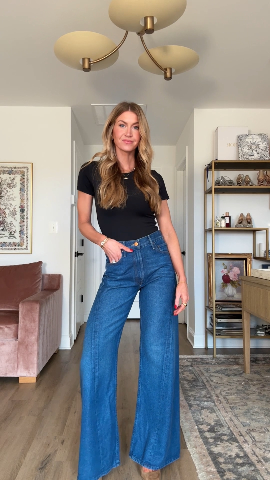 These jeans are some of the most flattering jeans I’ve put on my body - now 20% off!! Use code Leanne20  it works for anything from Anthropologie right now! 

High rise wide leg dark wash denim: runs BIG, I rec sizing down from your normal size. I’m in a 24.
Black bodysuit: runs small, order up if in between sizes, wearing S 

#LTKSpringSale #LTKSaleAlert #LTKootd