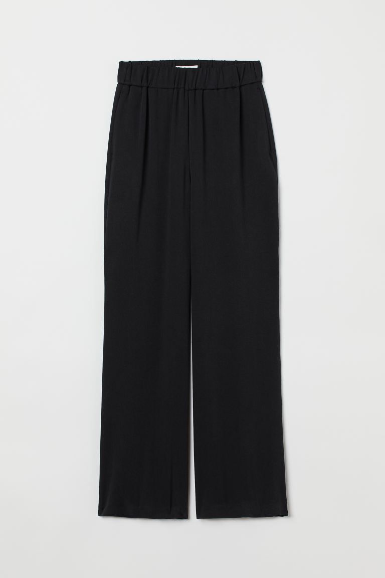 Pants in woven fabric made from a soft lyocell blend. High waist, waistband with covered elastic,... | H&M (US + CA)