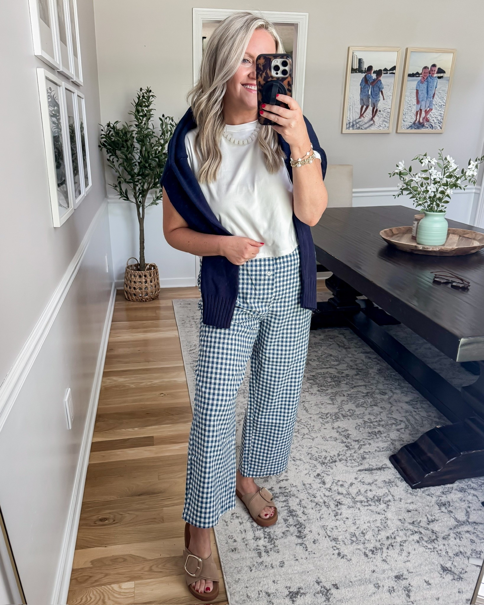 These gingham pants are such a fun change from basic denim for summer. I paired them with a simple white tee and a navy sweater for an easy coastal inspired look that feels classic, comfy, and elevated all at the same time.

gingham pants outfit, coastal style outfit, navy and white outfit, casual chic outfit, summer outfit idea, comfy everyday style, preppy summer fashion, easy neutral outfit, classic summer look, affordable fashion find, elevated casual outfit, cute vacation outfit, lovelylifestyling

#LTKSeasonal #LTKOver40 #LTKTravel