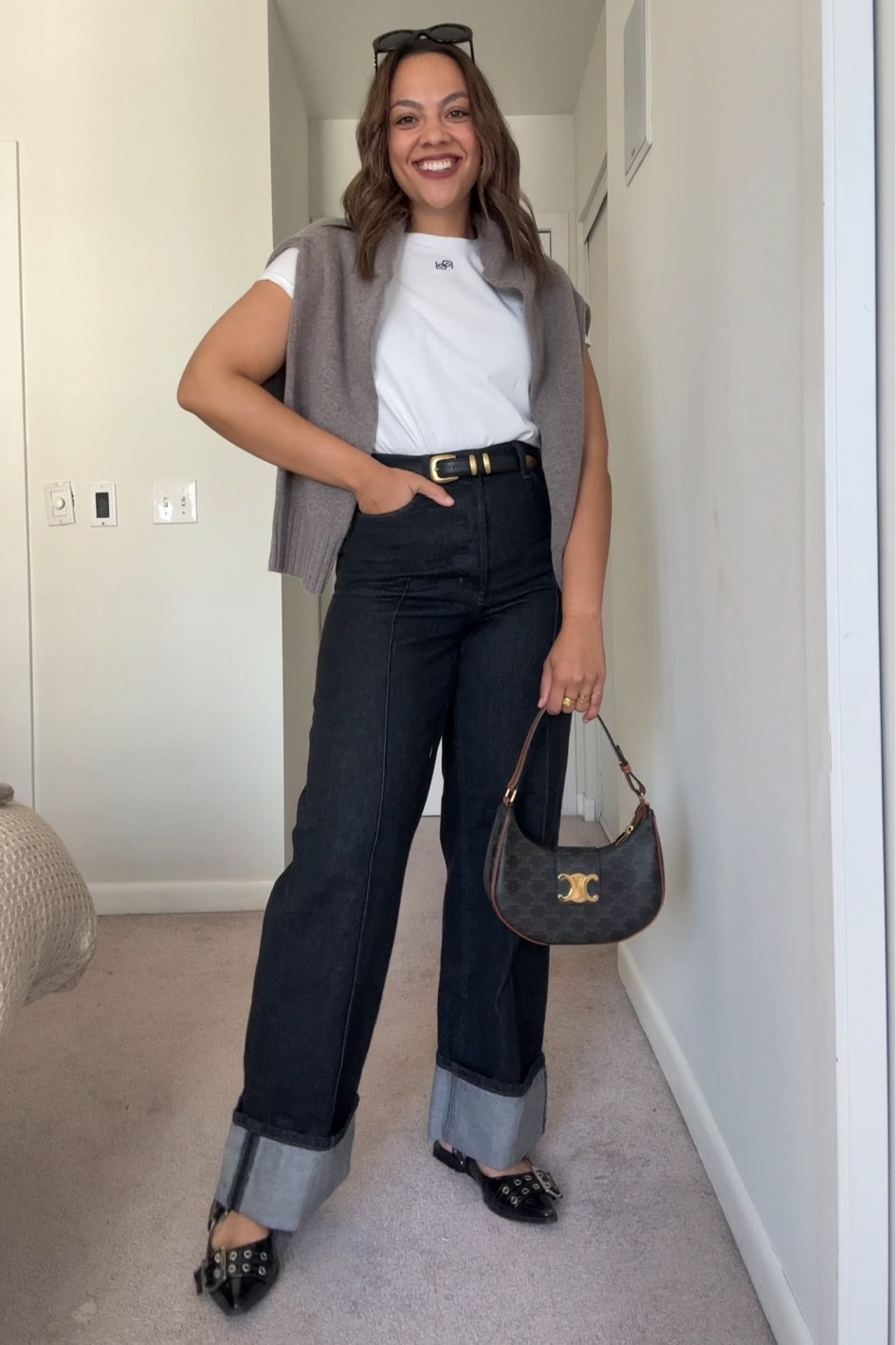 Fall outfit featuring a crewneck sweater and cuffed jeans!

-Reformation taupe wool crewneck sweater, I have a size large.
-Banana Republic cuffed black jeans, I have a size 29.
-Reformation white logo T-shirt, I’ve size medium.
-Black belt with gold hardware, similar linked. 
-Celine Triomphe Ava bag and sunglasses  
-Steve Madden black patent leather pointed buckled flats.


#LTKautumn #LTKstyletip #LTKcanada