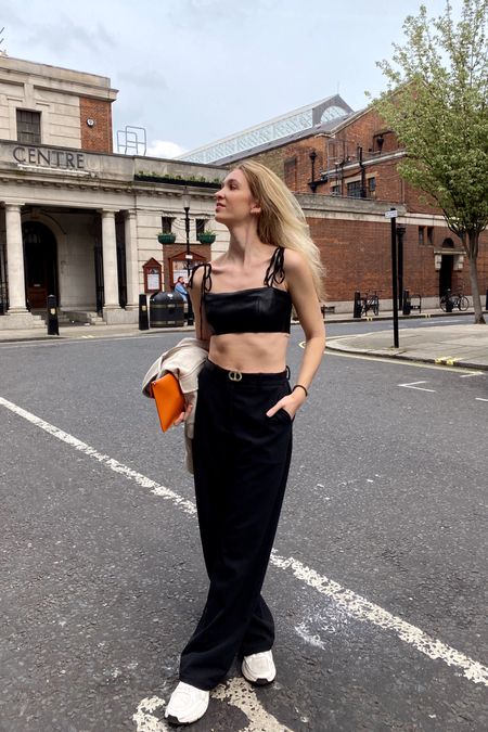 Insta & TikTok @pmmatter for outfit inspiration 🖤 Any questions? DM me on Insta! - minimal style, street style, casual elegant, easy outfit, everyday style, outfit inspiration, clean girl aesthetic, black wide leg trousers, black leather crop top, white trainers, beige sneakers, orange clutch 

#LTKstyletip #LTKfit