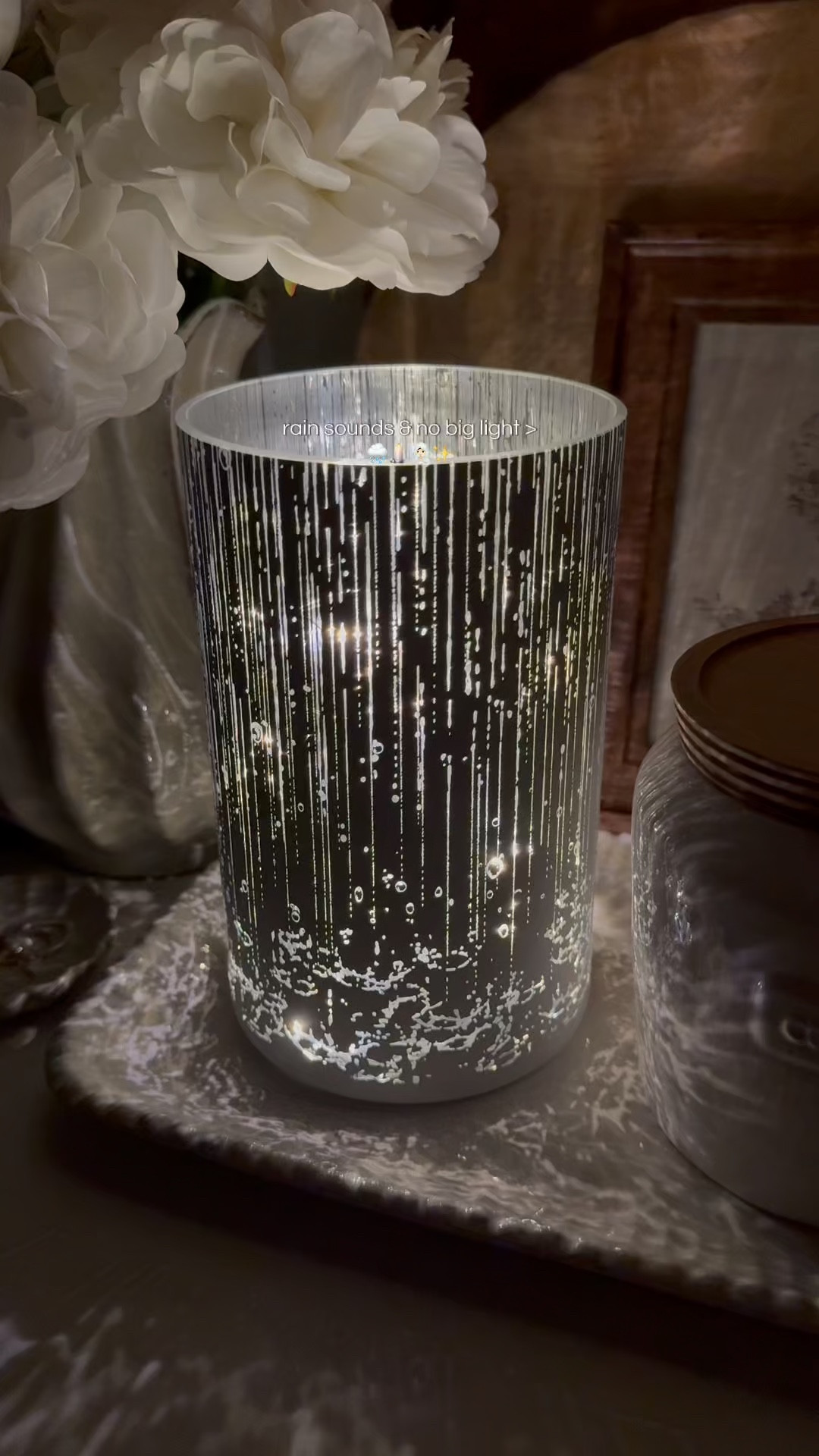 Is there any better sound than the sound of falling rain?! The 8" Relaxing Rainfall Lit Hurricane with Sound by Valerie features twinkle lights (steady or flickering), rainfall sounds with adjustable volume (or no sound, just lights), a timer, a remote, and a stunning rainfall etched design 🌧️✨🕯️

#LTKMothersDay #LTKselfcare #LTKHome