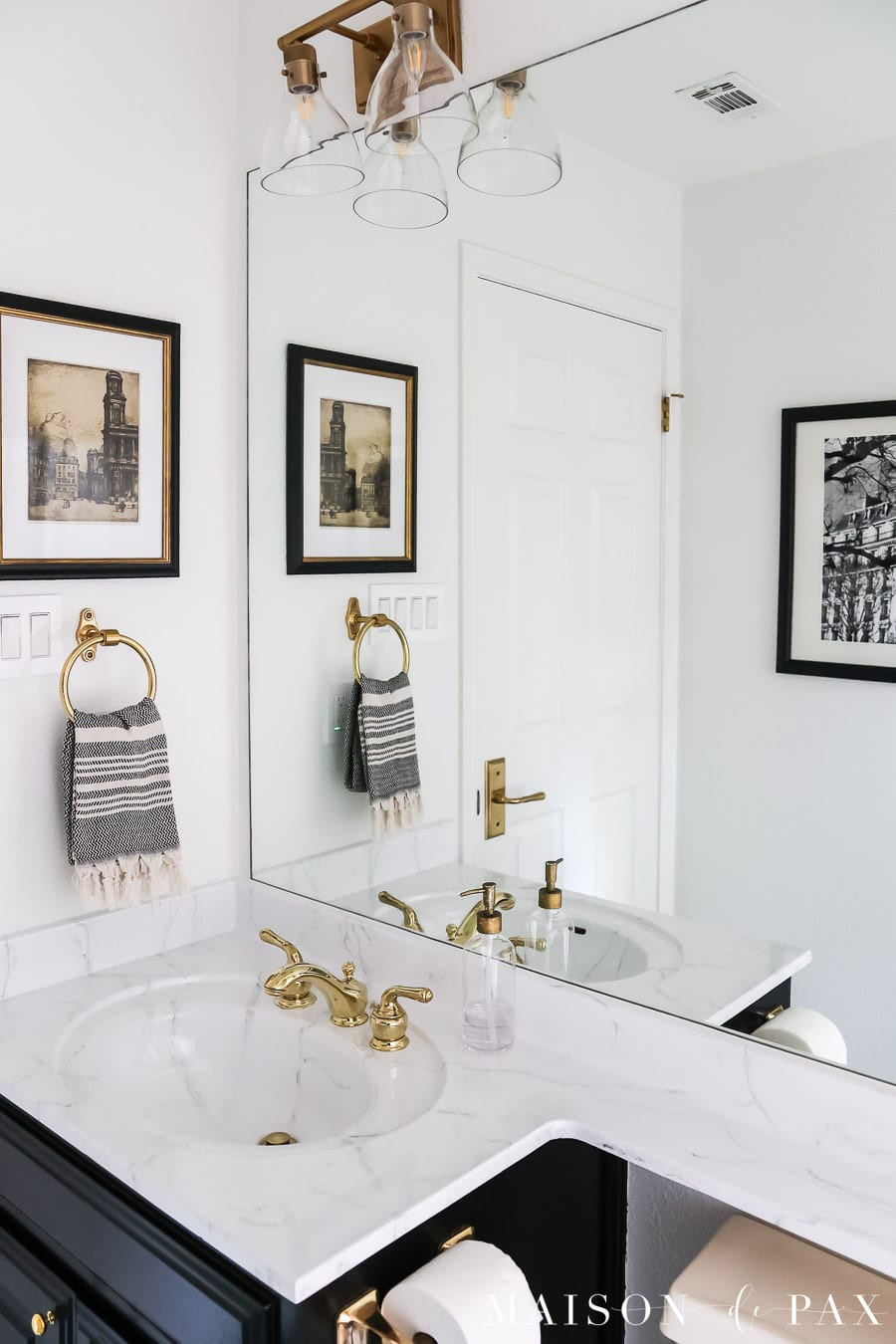I love how the painted marble-look countertops elevate this bathroom, and I’ve linked the products and supplies used to create this finish. 

 #LTKHome