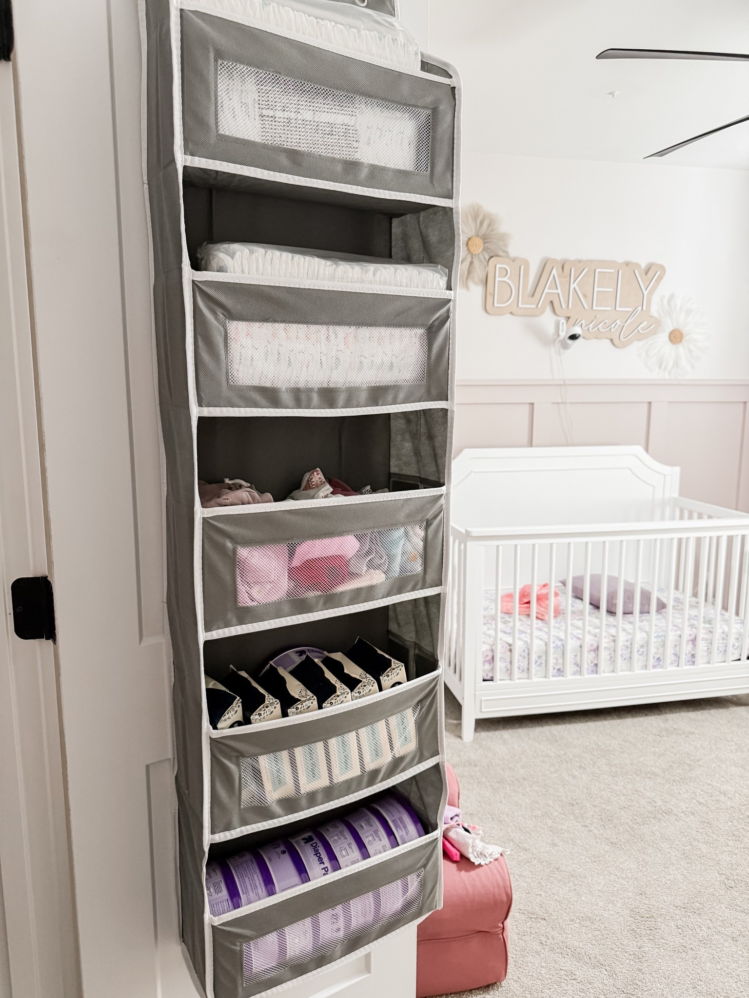 Absolutely love using this over the door hanger for diapers, wipes and diaper pail refill bags, I also use it for all her daycare clothes so I can easily grab them when I need too! 

Nursery organizer, nursery organization, baby girls room, baby room must haves. Over the door organizer, home organization, home must haves 

#LTKHome #LTKBaby #LTKBump