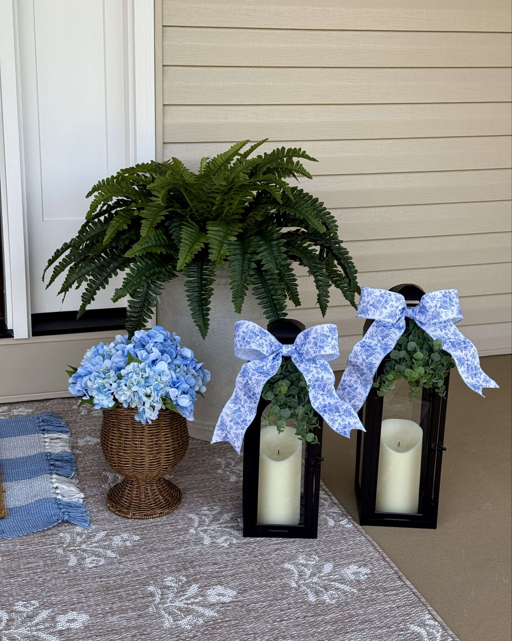 Updated Spring porch refresh pictures to include the bows and greenery I added to my lanterns. I love blue chinoiserie with hydrangeas! I like this for spring and summer and the color scheme will look great when I add red this summer. ❤️🤍💙

#LTKHome #LTKSeasonal