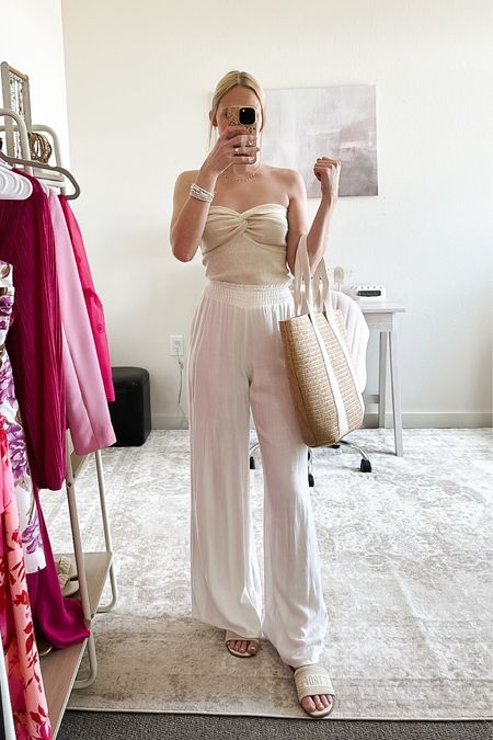 Vacation Outfit! ☀️🏝️ If you’re headed somewhere warm for Spring break, you’ll want to pack this Amazon strapless tank and gauzy white beach pants ☺️

This twisted knot tank fits true to size, I’m in an XS. It has great quality fabric, leaning on the thicker side. Wearing an XS in the white linen pants as well.

Vacation outfits, resortwear, spring break outfits, vacation outfit, resort wear, spring outfit, vacation wear, spring break 2024, college Spring break, Target sandals, Target shoes, summer shoes, beach day outfit, beach outfit, beach vacation outfit, casual spring outfit, elevated vacation outfit, vacation dinner outfit #vacationoutfitsbeach #vacationlooks #beachdayoutfit

#LTKSeasonal #LTKsalealert #LTKswim