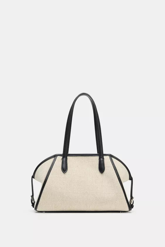 Bowling shoulder bag. Top in combined materials. Double shoulder strap. Interior compartment with... | Zara FR