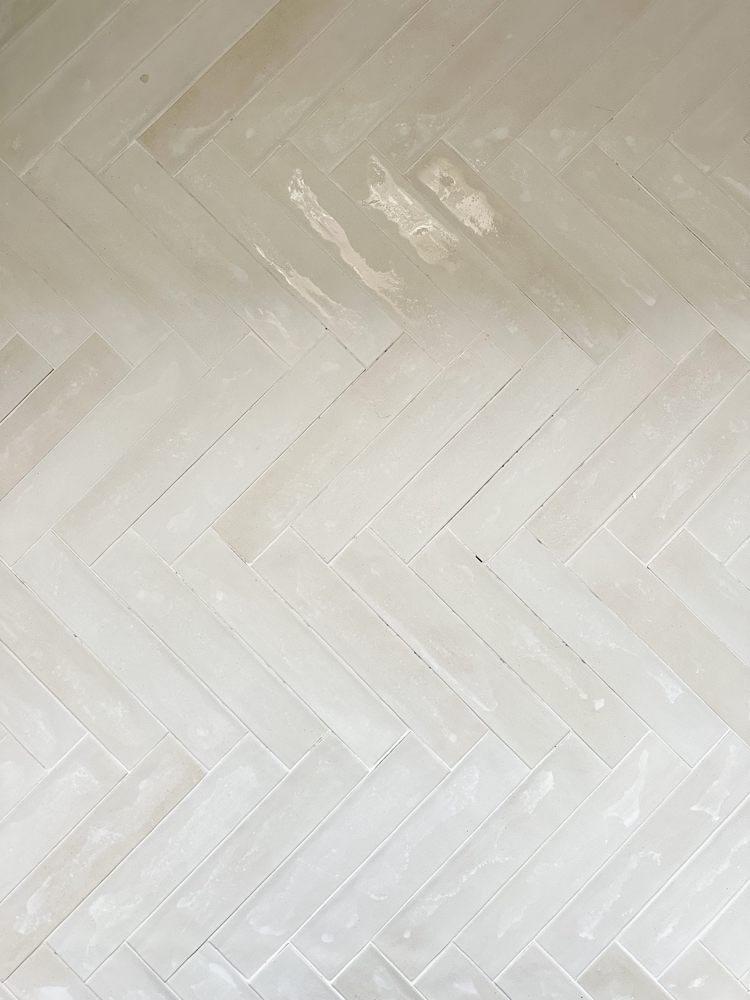 Floor tile from Bedrosian Tile in Celine with bright white grout. 