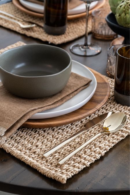 Thanksgiving table setting with gold flatware, wooden servers, earthy green bowls, linen napkins, and textured place mats 

#LTKhome #LTKfindsunder50 #LTKHoliday