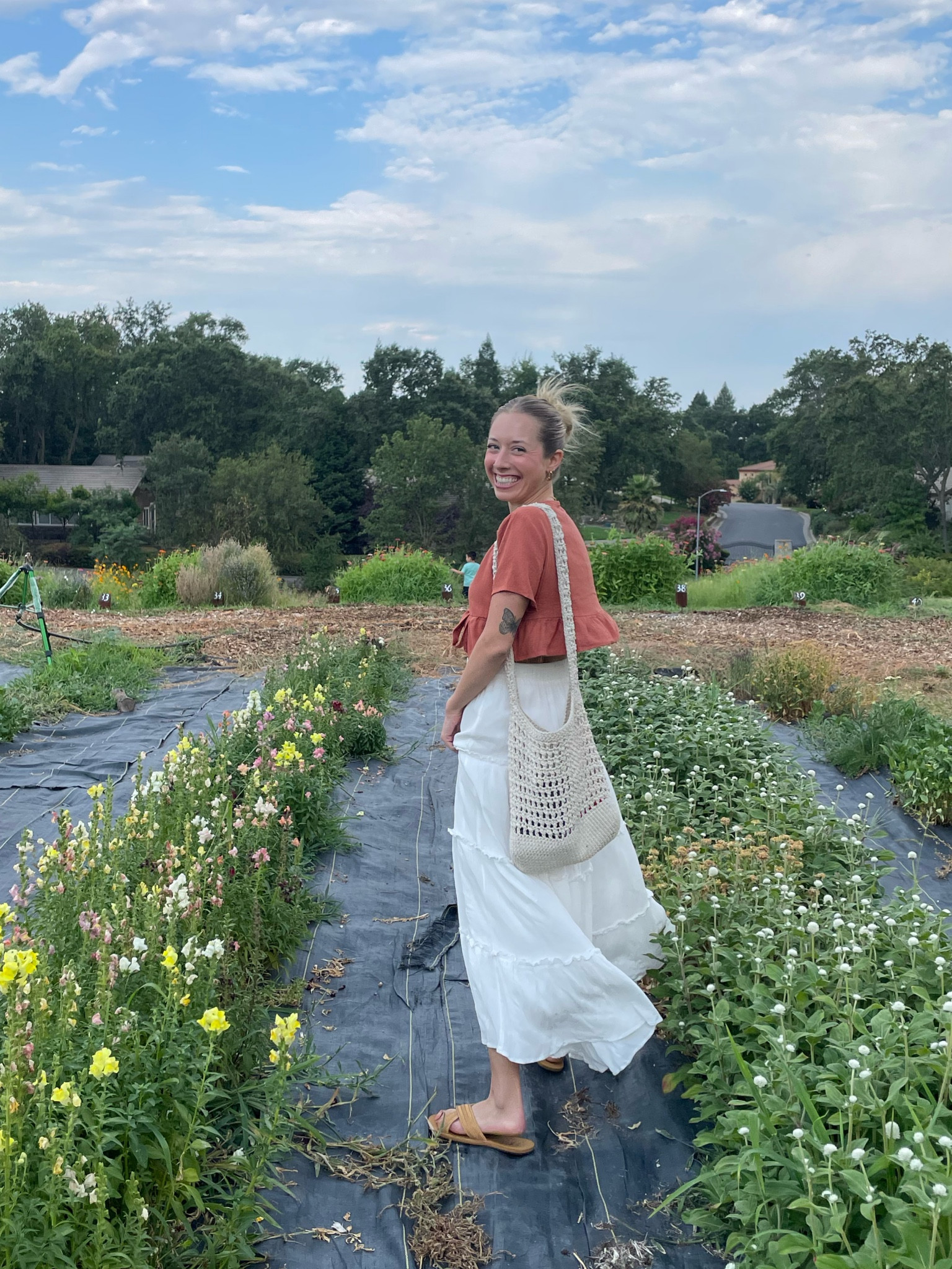 Summertime flower picking dates >>>  I felt like I was in a rom com!! 🥹🧚‍♂️💖 This is truly my go to date skirt. I thrifted this tie front top and can’t find it anywhere, so linked other orange and tie front tops I think would be SO cute with this skirt!! 

#LTKSeasonal #LTKFindsUnder50 #LTKFindsUnder100