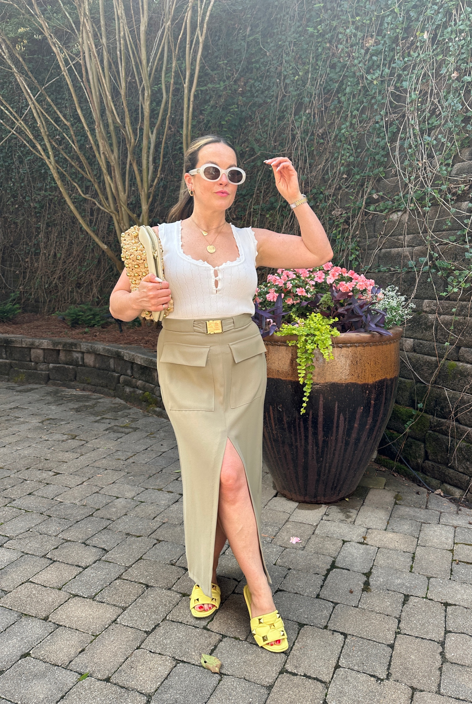my go-to summer dressing strategy is spend on accessories, save on clothes 

midi skirt outfit, celine triomphe sunglasses, valentino sandals 