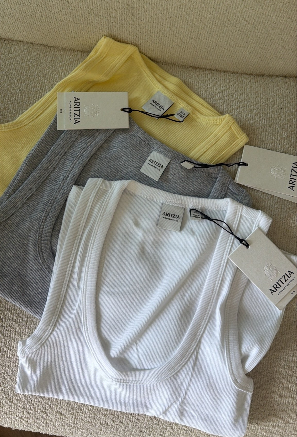 Aritzia basics are SO good 🤌🏼
Grey & white are the ‘home stretch vinyl tank’ 
Yellow is the ‘home stretch rib frequency tank’