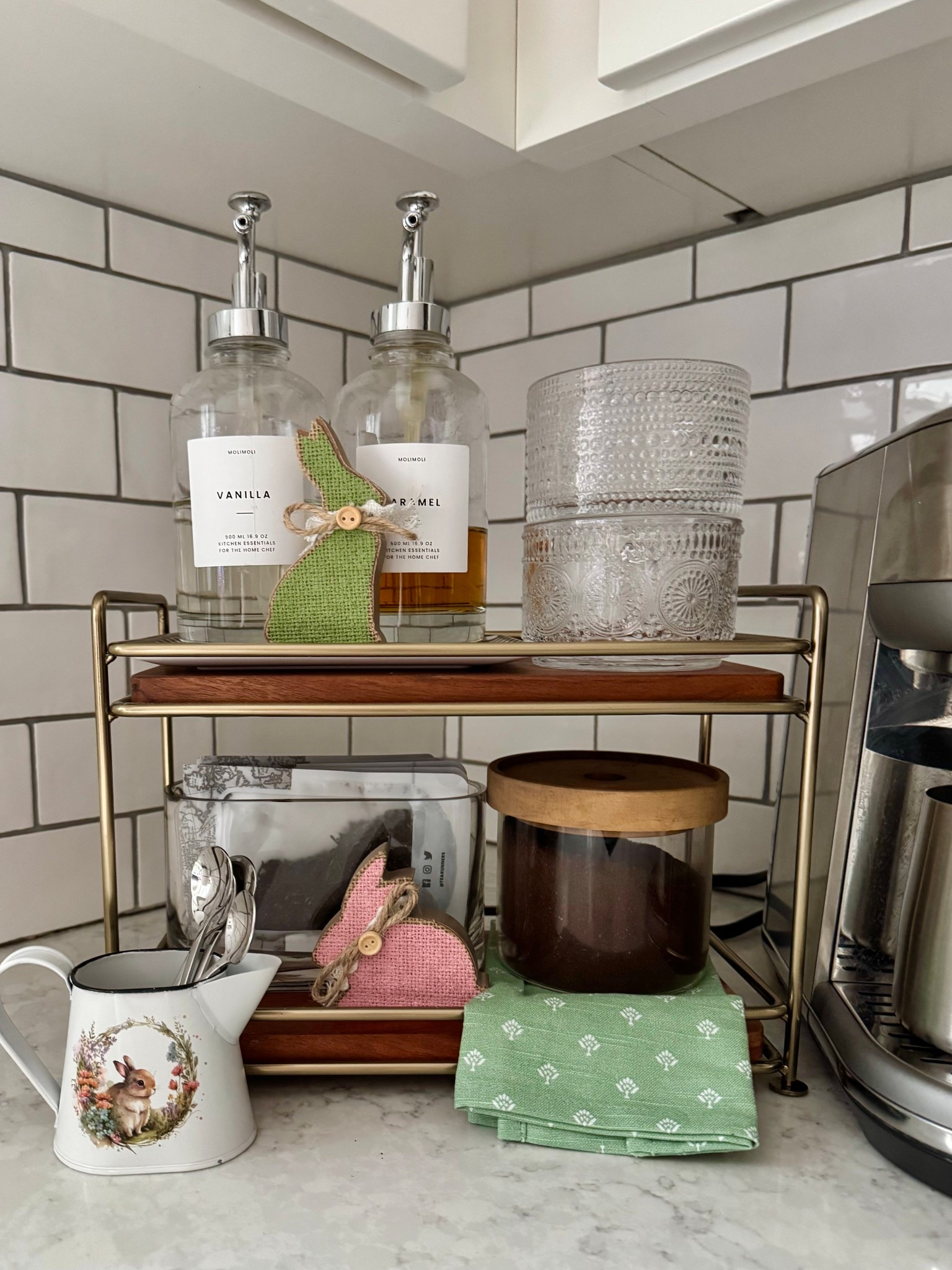 Coffee corner Spring styling! 
Just add a few bunnies - these bunnies and the metal pitcher are all Hobby Lobby finds 

Coffee | stackable latte mugs | tiered serving tray | syrup dispenser | glass canisters | espresso machine | coffee corner | tea storage 

#LTKStyleTip #LTKSeasonal #LTKHome