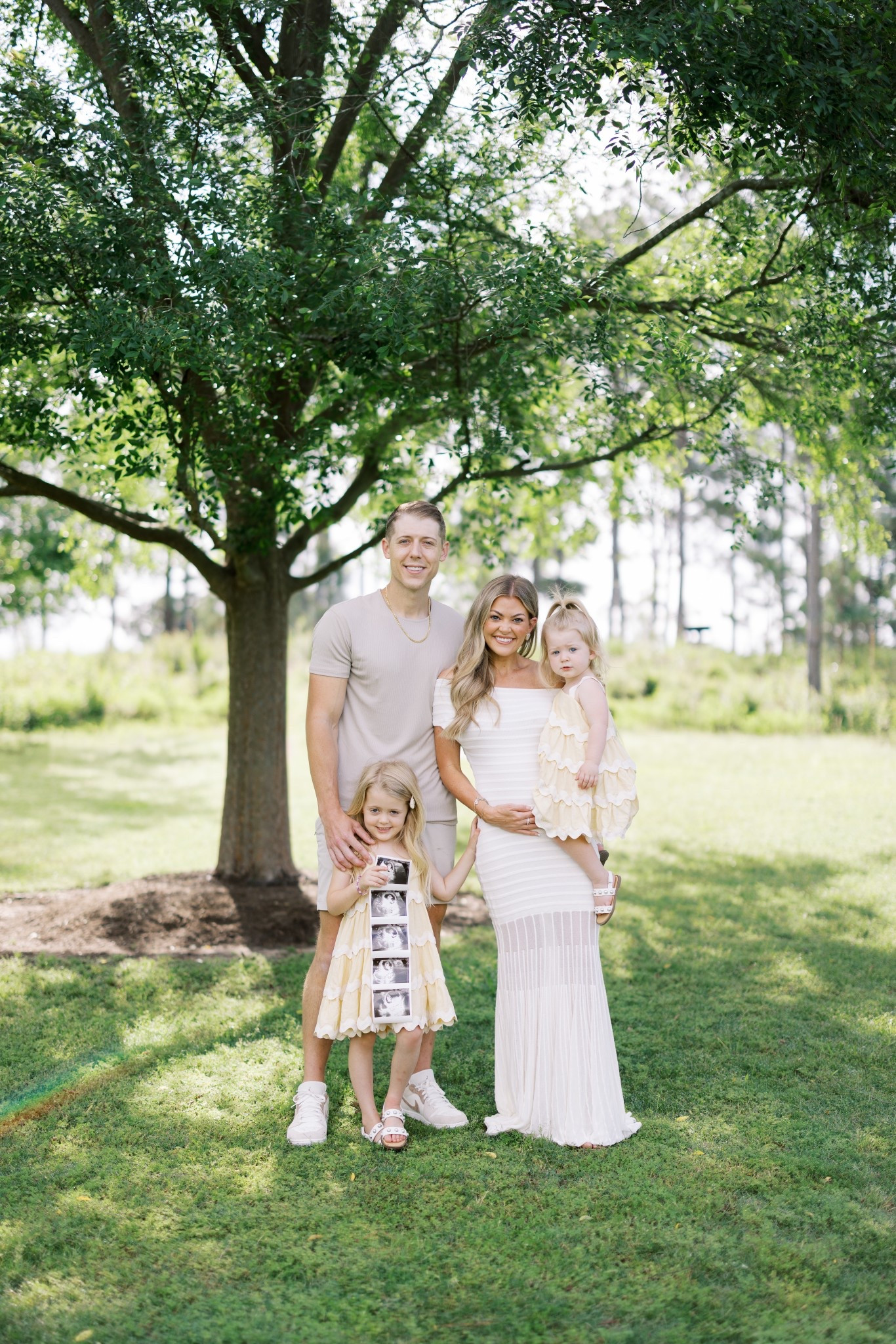 our hearts and hands are so full 👶🏼🤍✨ baby #3 coming in nov! thank you Jesus for this blessing. 

(wearing size small in dress) 

baby announcement, white dress, vici, maxi dress, pregnancy, bump friendly, toddler dress, family photos 

#LTKFamily #LTKBaby #LTKBump