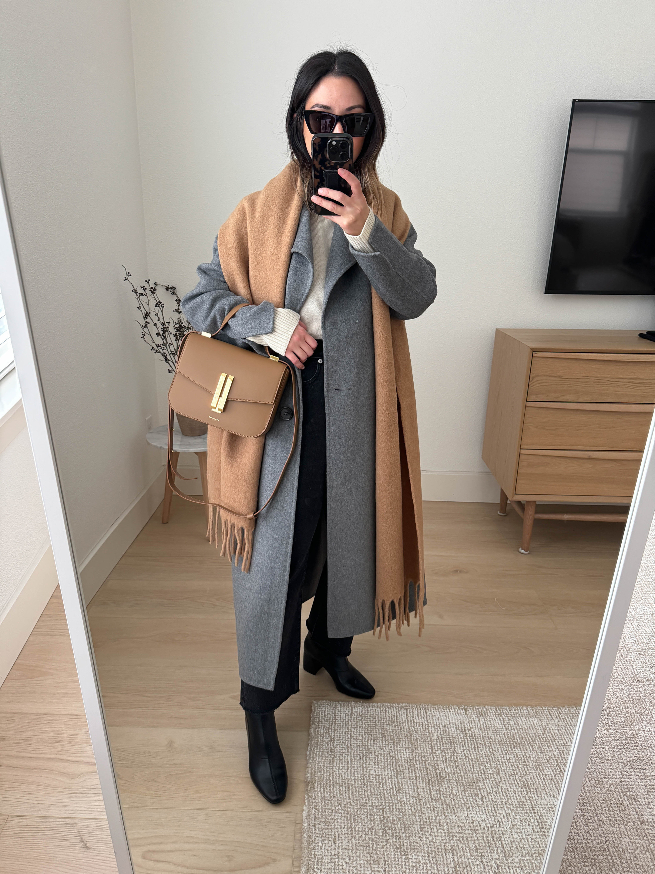 Denim and boot outfits. How to style jeans and boots. The key is to wear your jeans over your booties. Make sure your booties have a tall enough shaft. 

Banana Republic coat petite xs
Everlane sweater xs
 Madewell jeans 25. Sized up cut hems
Uniqlo scarf
DeMellier bag 
Donald Pliner Boots 5.5
YSL Sunglasses

#LTKSeasonal