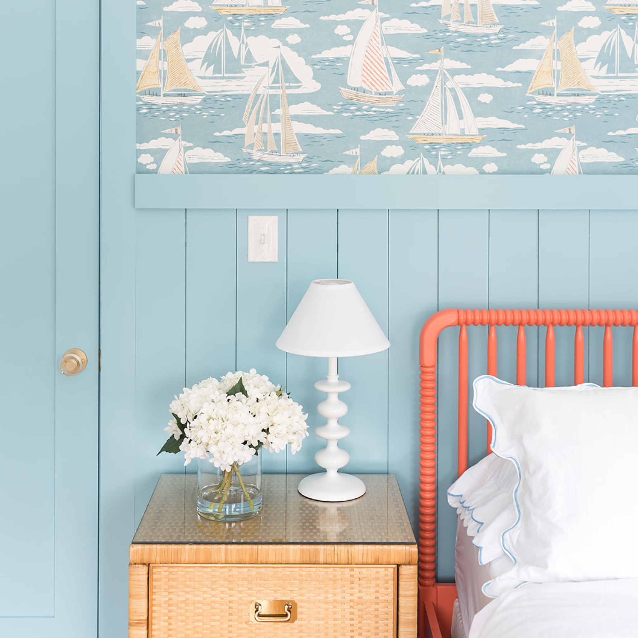when designing the bedrooms at the #mixedusemini, we aimed to give each bedroom its own identity and create unique and special spaces for guests. inspired by Marblehead’s nautical past, we chose this beautiful @sanderson1860 wallpaper featuring red, white, and blue sailboats and paired it with vertical shiplap paneling to provide both visual interest and durability. we pulled a shade of blue from the wallpaper and painted the paneling, trim, and doors in both bedrooms this vibrant color. a vintage rattan nightstand, coral Jenny Lind spindle bed, and custom embroidered scalloped sheets make this bedroom an inviting and relaxing space for a #dwelloctoberstay getaway! #dwelloctober 

#LTKHome