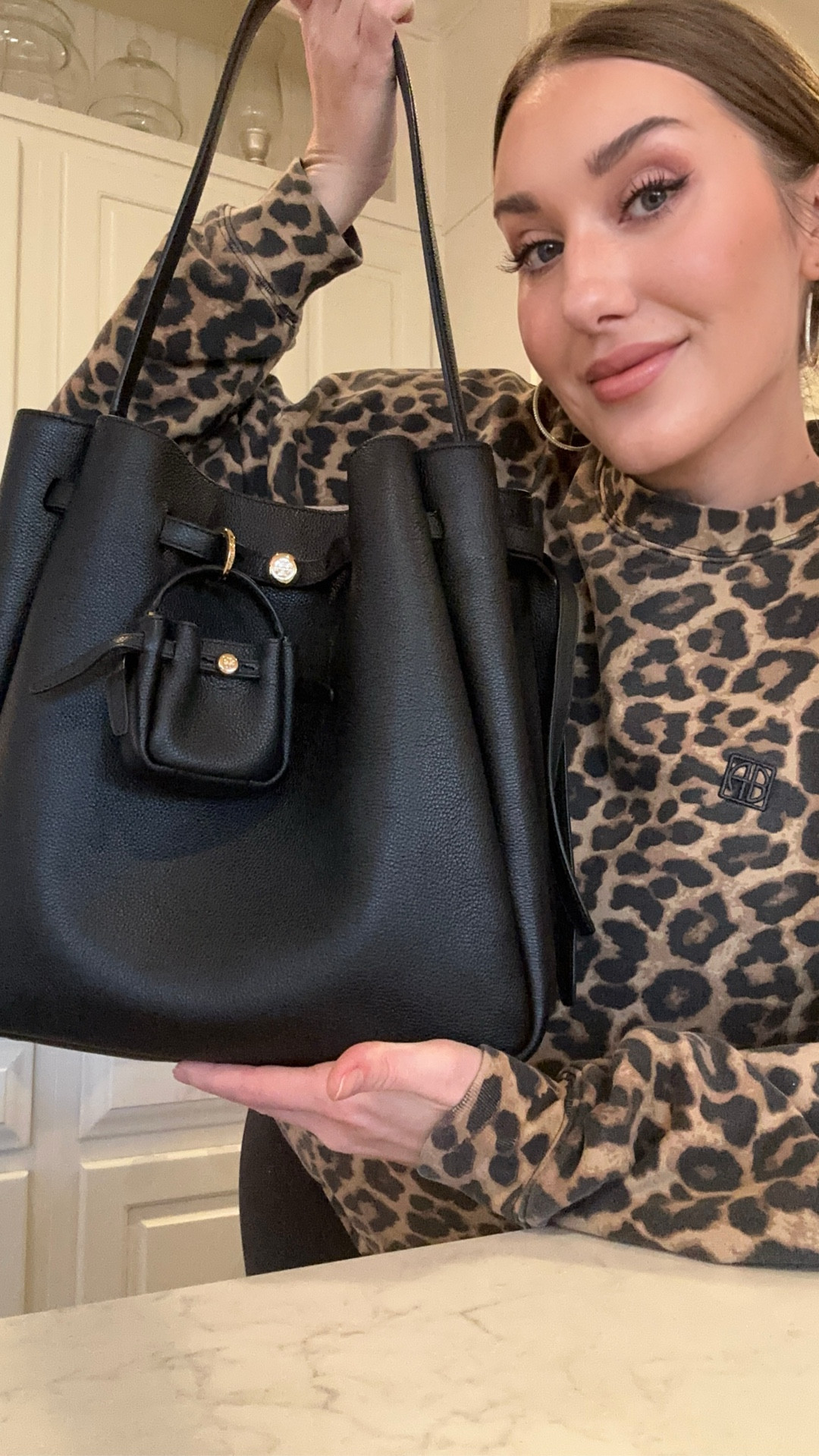 The BEST bag I’ve ever owned…. Now
Has a lil bag of her own 🥹 it’s an exact mini of the big gal…. The details and quality are insanely great. The bag charm adds so much to it 🖤

#LTKootd #LTKWorkwear