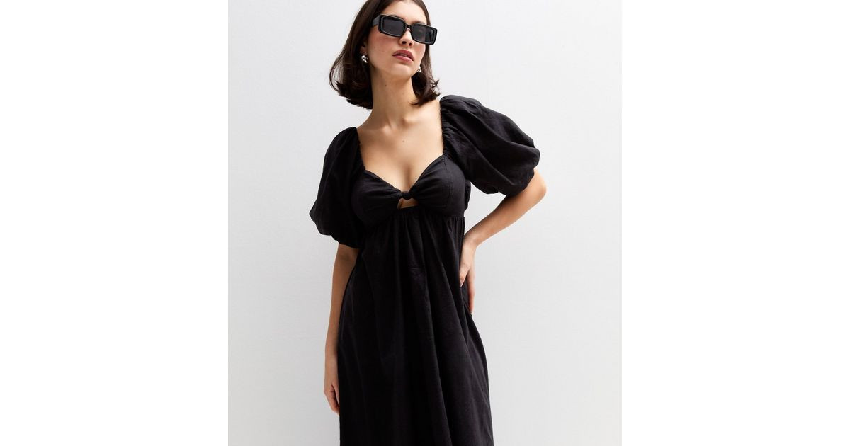 Black Puff Sleeve Knotted Front Midi Dress
						
						Add to Saved Items
						Remove from Save... | New Look (UK)