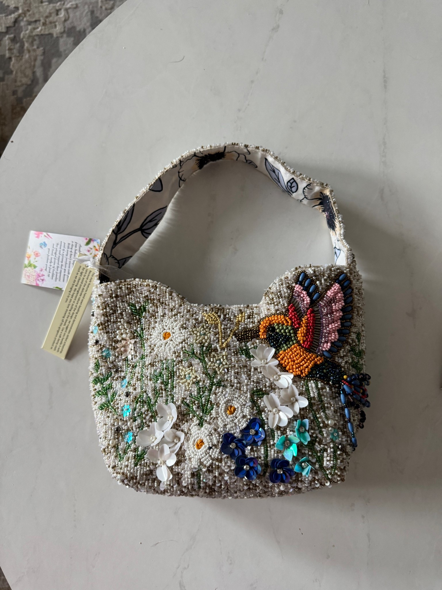 Beaded hummingbird handbagg

#LTKSeasonal #LTKOver40 #LTKSaleAlert